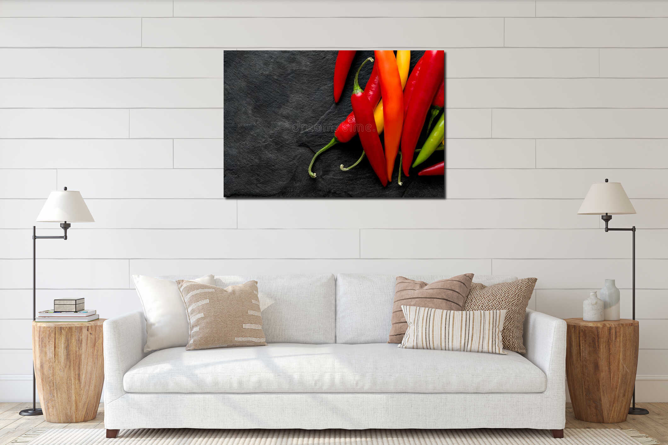 Pile of mixed red, yellow, orange and green cayenne chillies  on black slate from above. Space for text interior mockup