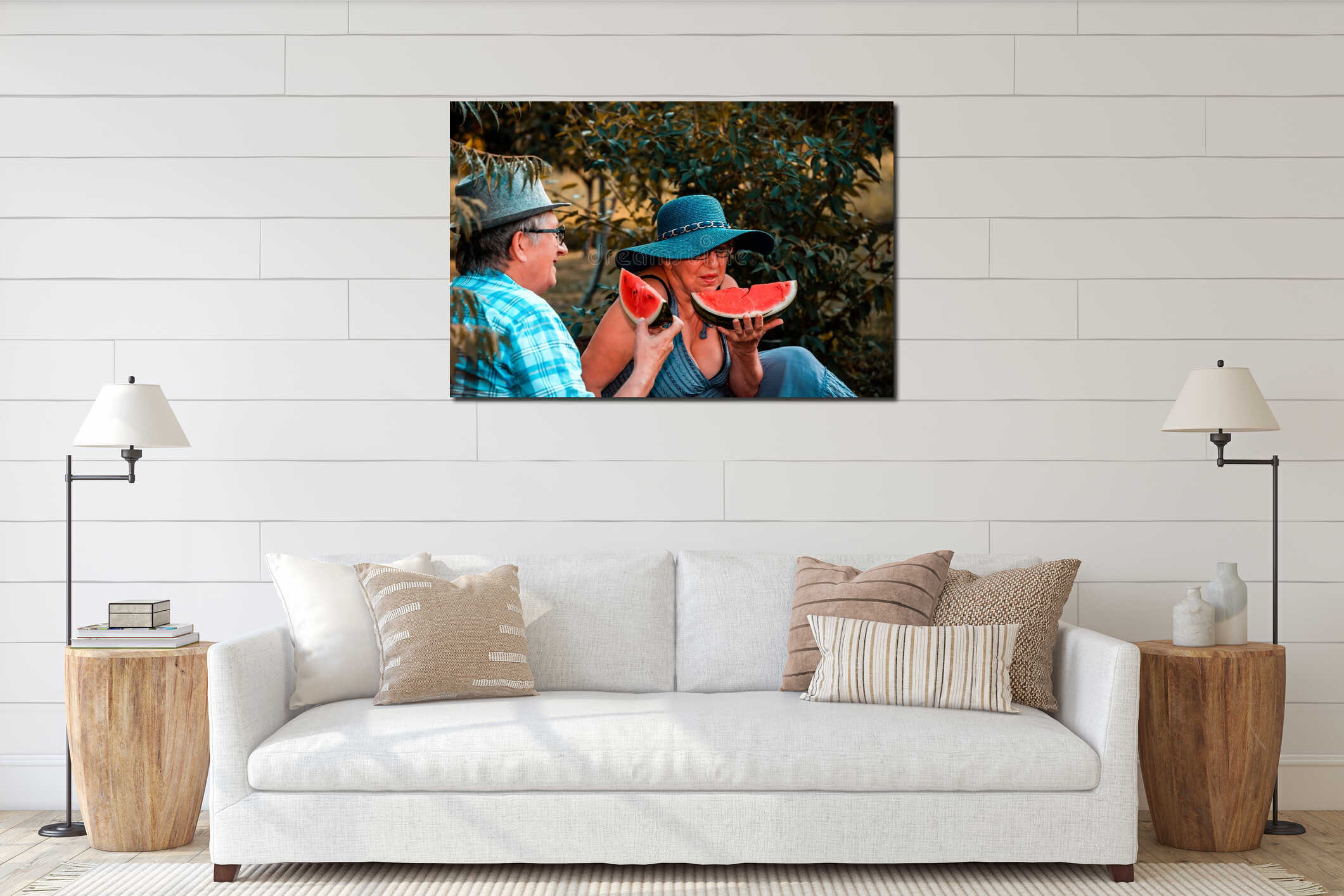 Happy senior loving couple eating watermelon and having a great time together on a picnic interior mockup
