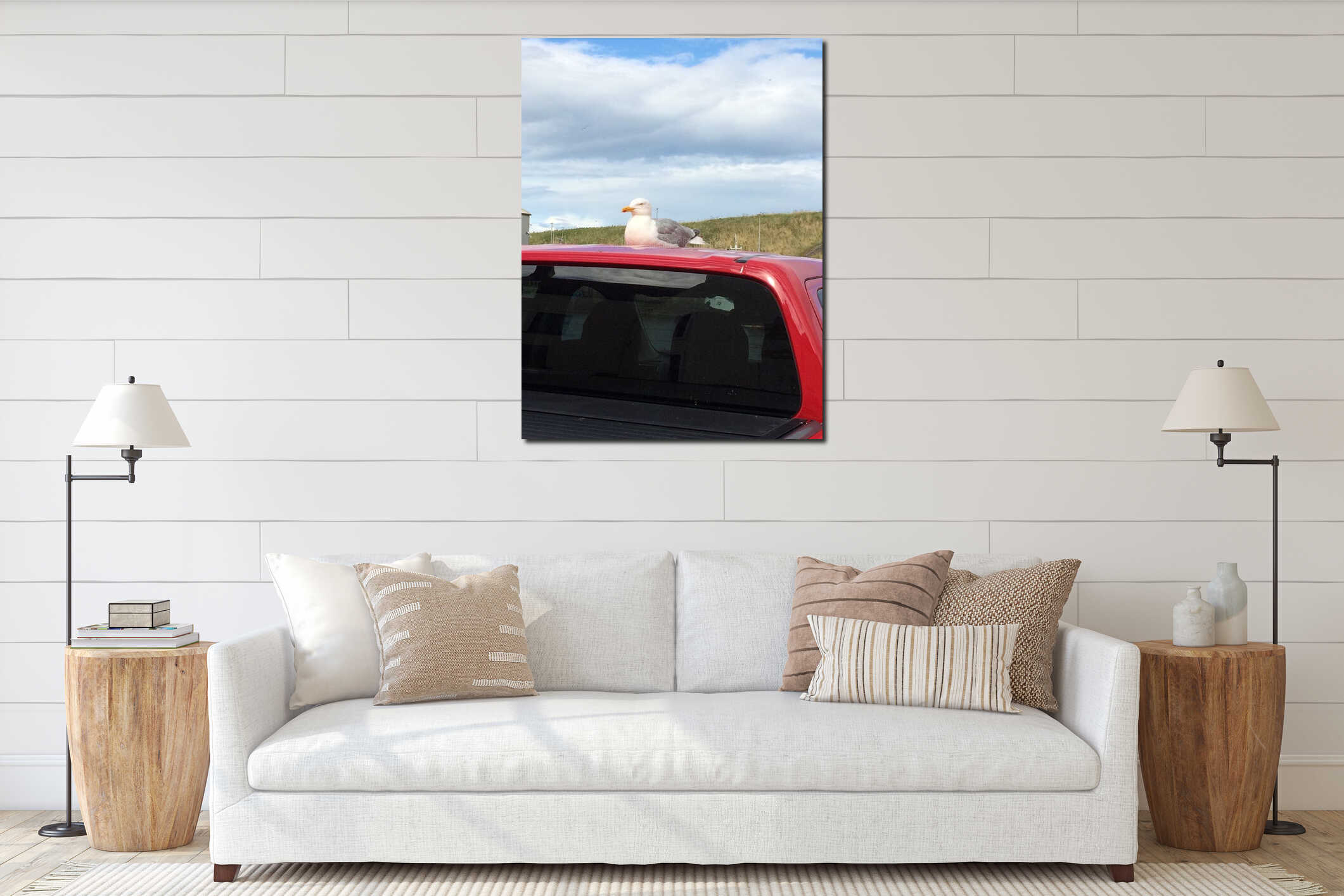 Seagull sitting on top of red car near the beach interior mockup