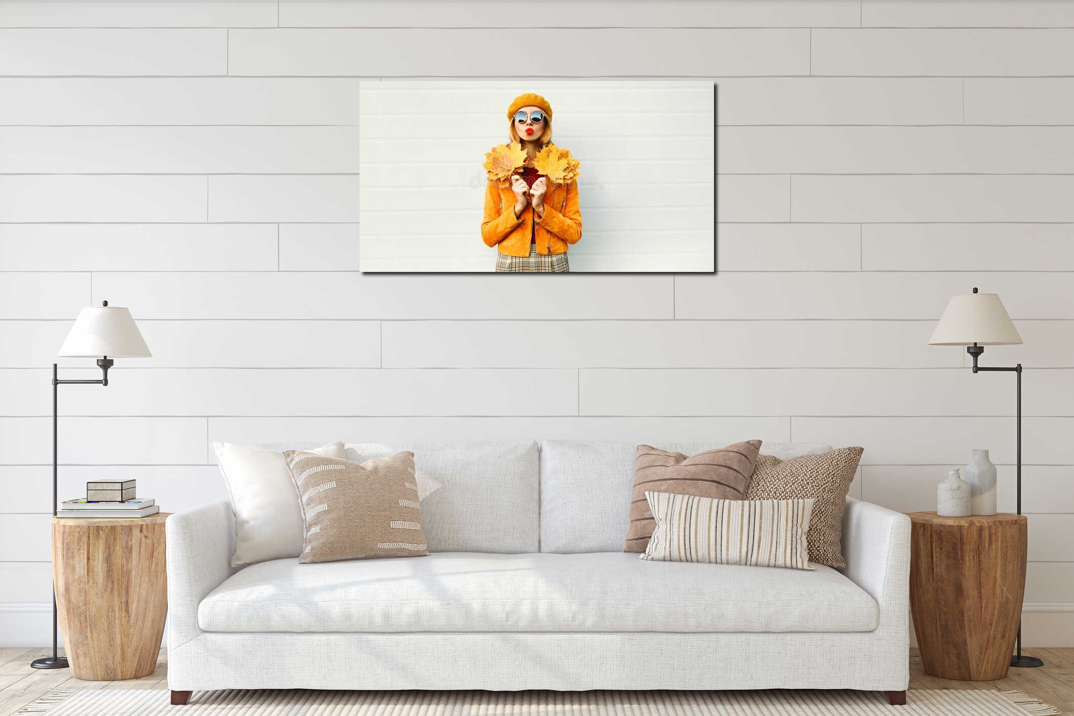 Autumn portrait woman holding yellow maple leaves blowing red lips sending sweet air kiss in french beret posing over gray wall interior mockup