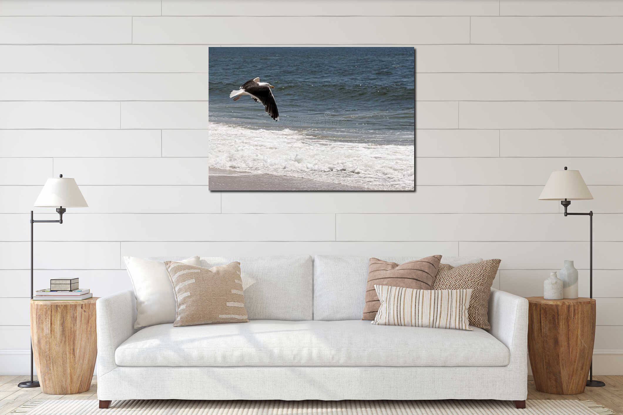 Seagull flying low at the edge of the ocean interior mockup