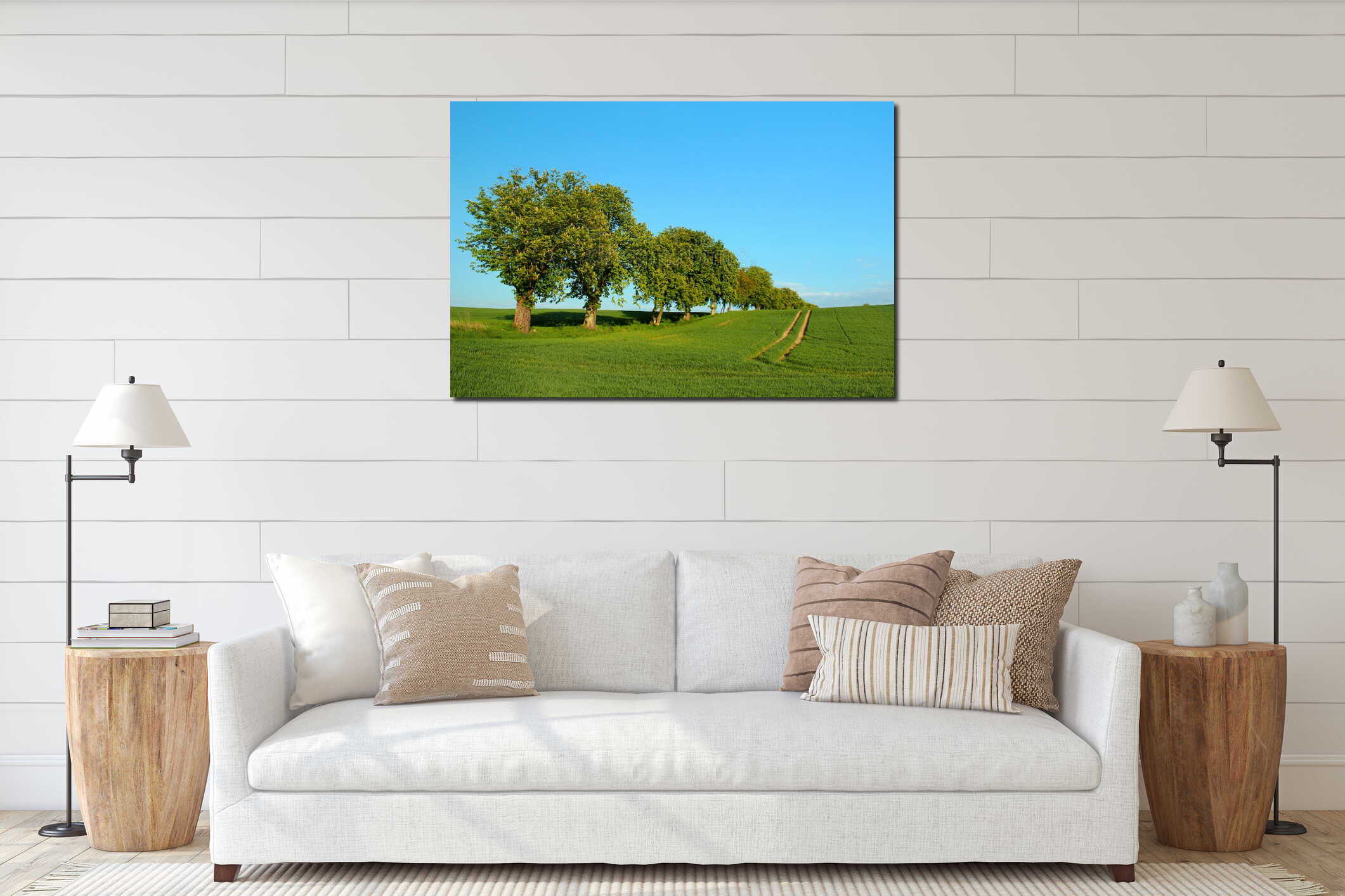 Row of chestnut trees on a green field against blue sky background. Idyllic summer landscape interior mockup