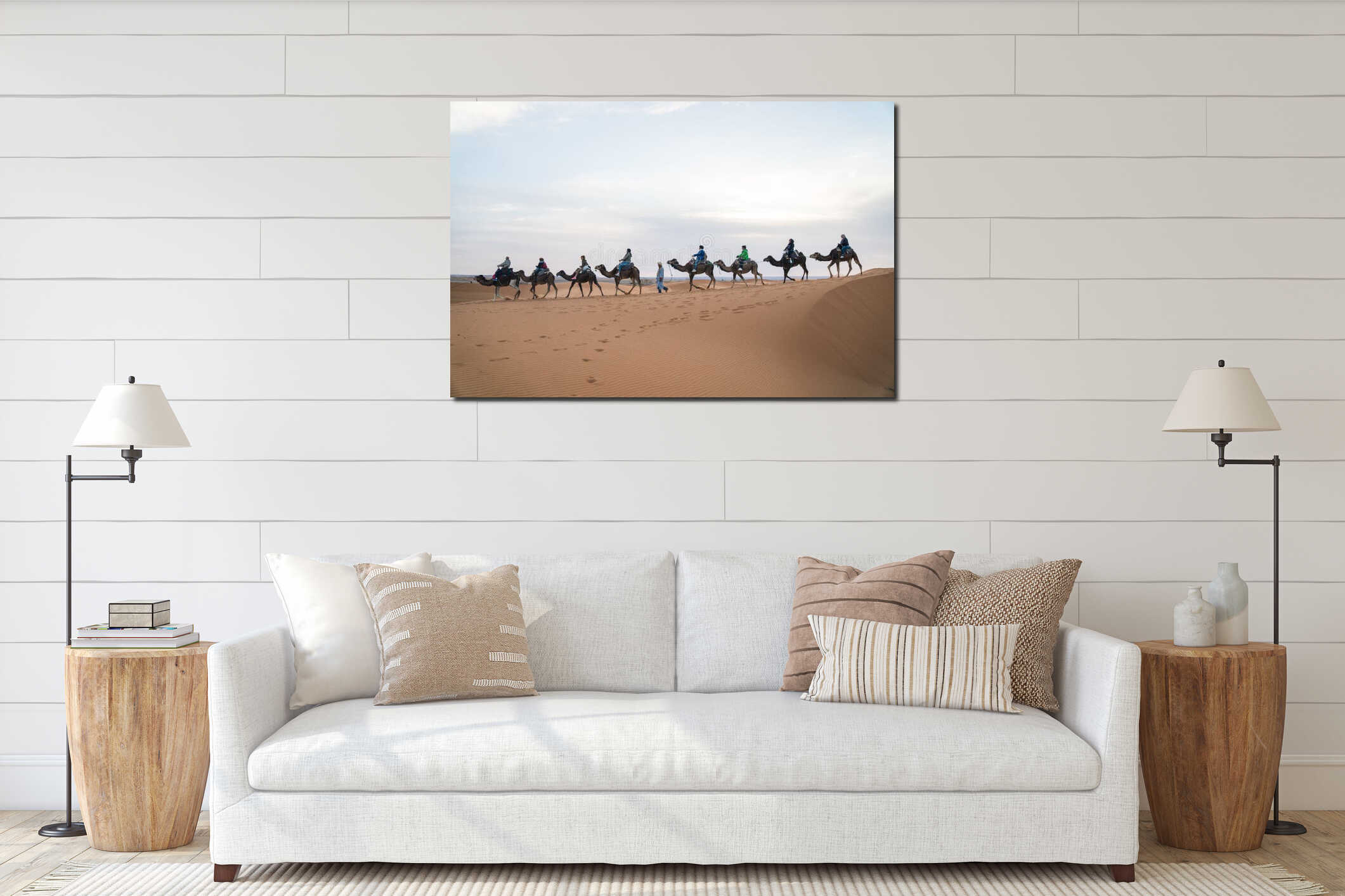 Merzouga, Morocco - APRIL 29 2019: View of tourists on a camel ride tour in Sahara Desert, symbolic representative tour interior mockup