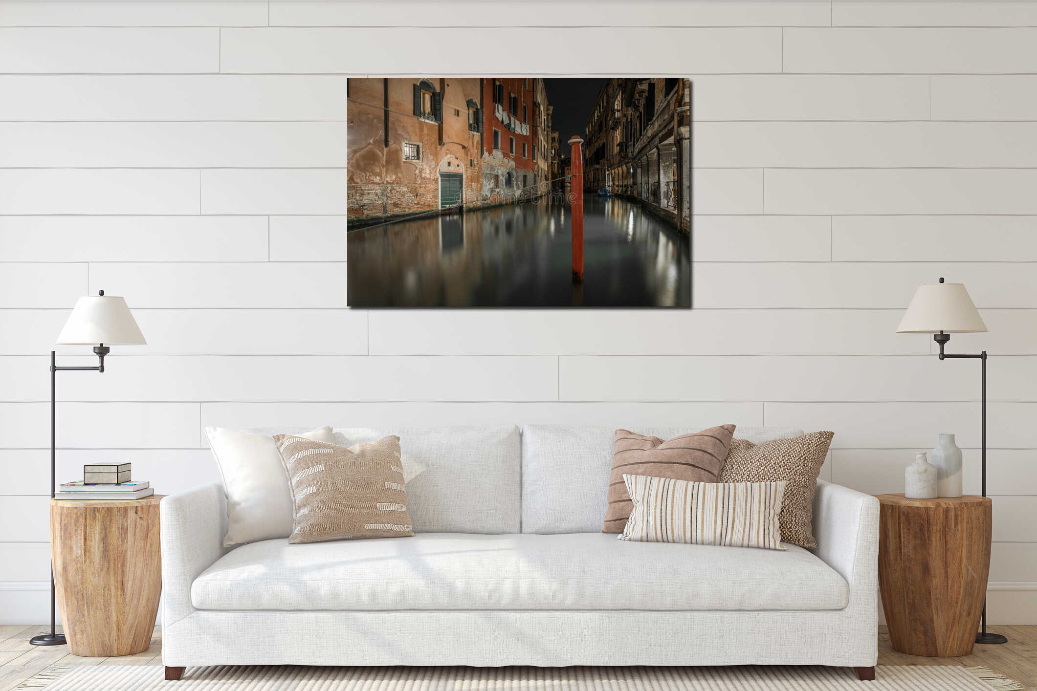 Horizontal shot of a canal between the old buildings in Venice, Italy during nighttime interior mockup