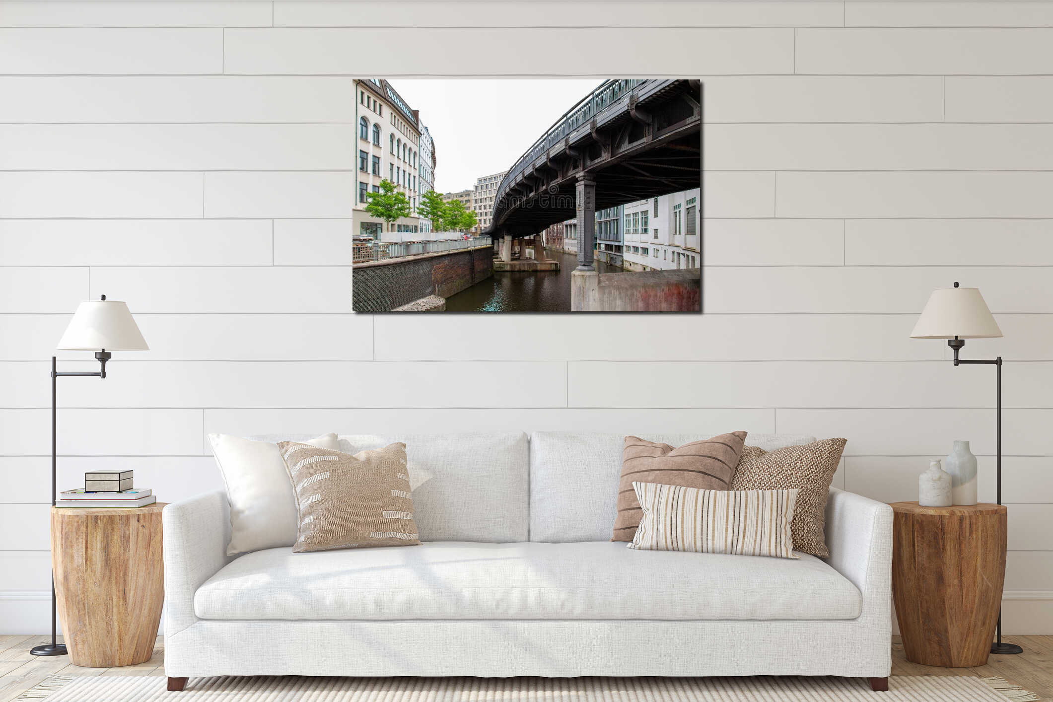 Horizontal shot of a long bridge with columns on the canal near apartment buildings interior mockup