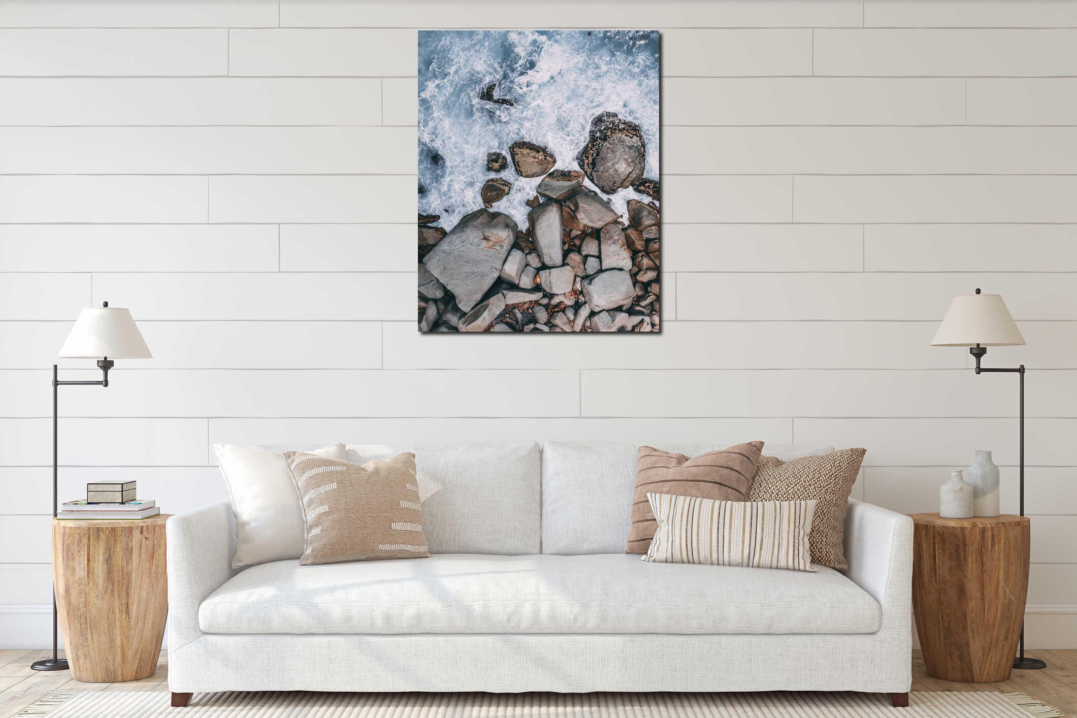 Vertical high angle shot of big stones in the stormy ocean water interior mockup
