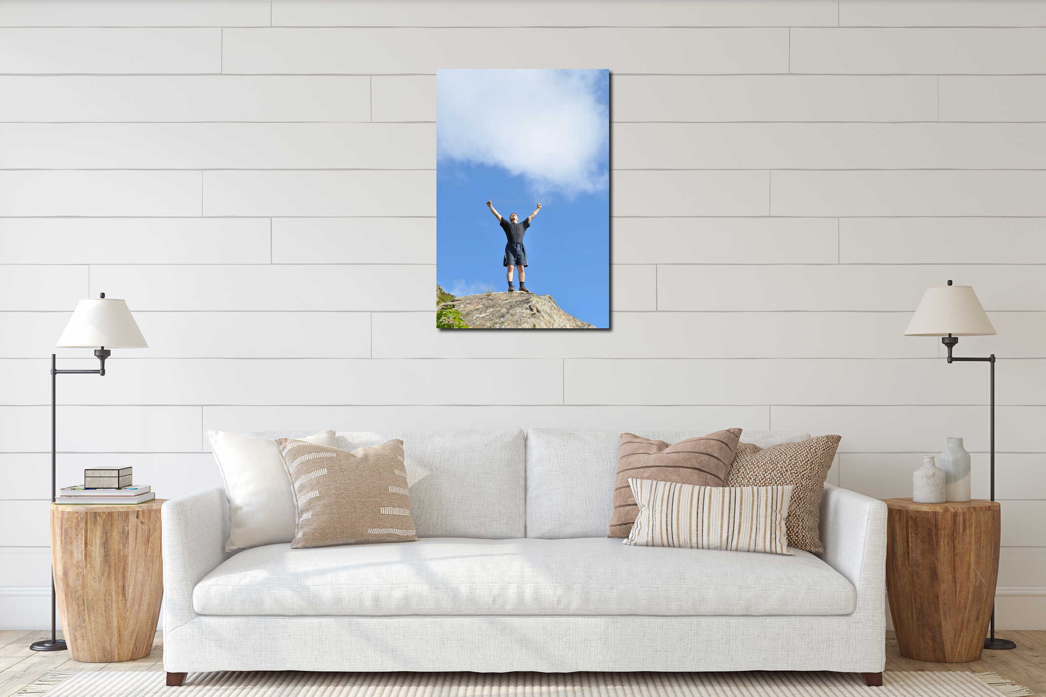 A young man stands on a cliff top and raised his h interior mockup