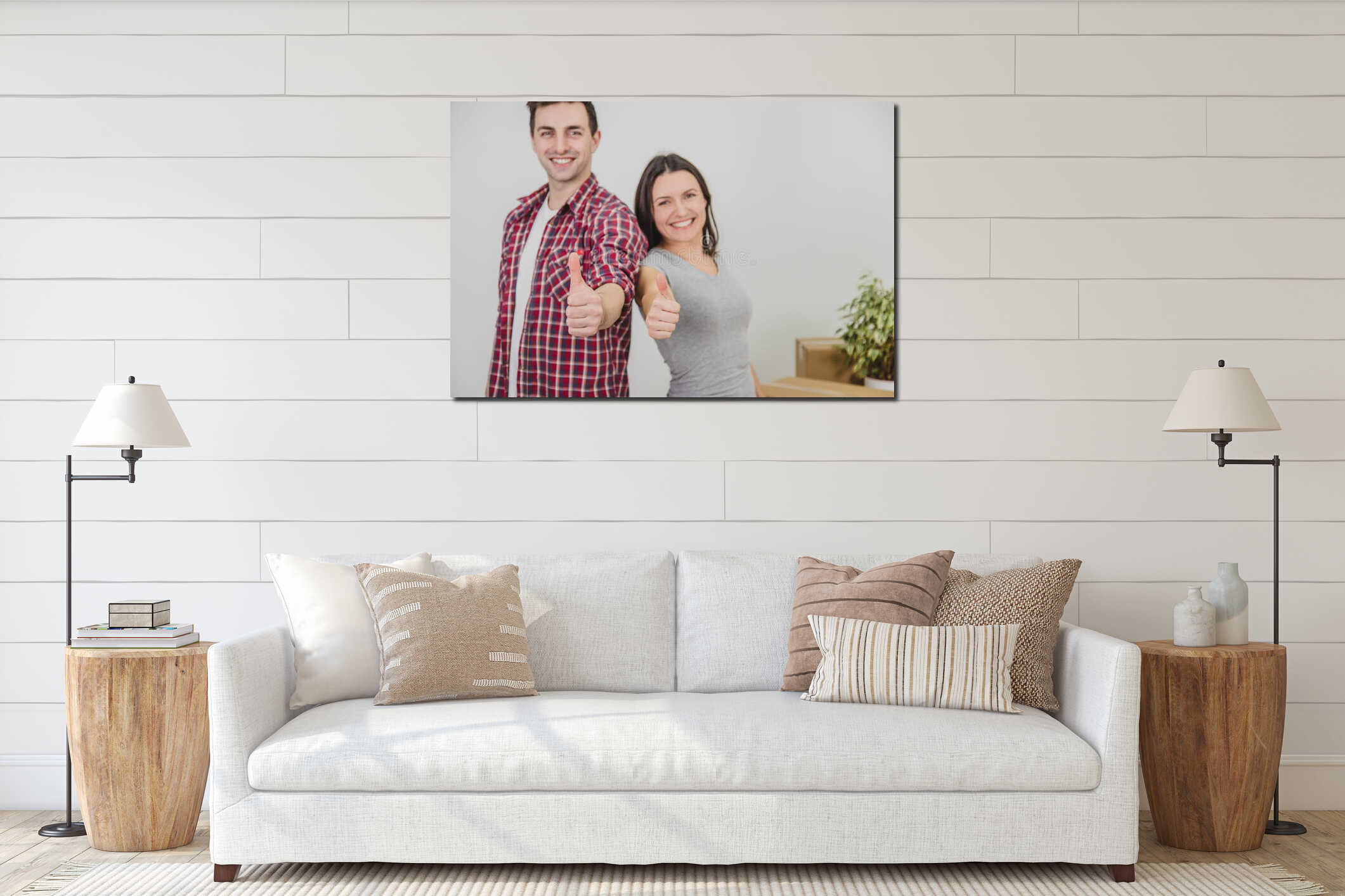Close up of happy man and woman standing near stack of carton boxes in their new apartment, giving thumbs up, smiling. interior mockup