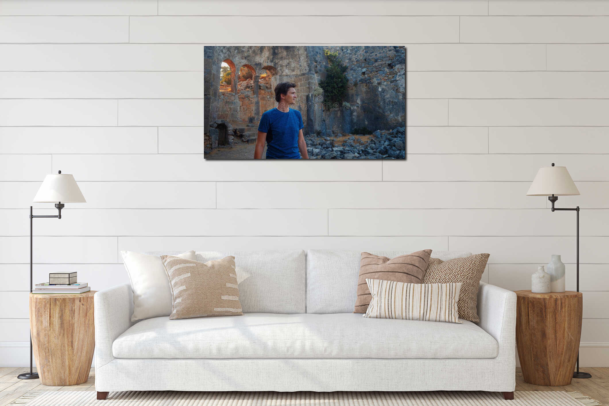 Young man tourist on the background of the ruins of ancient buildings. interior mockup