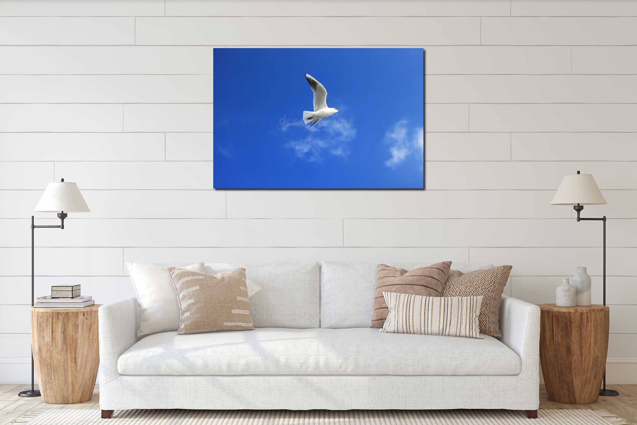 Single seagull spreading its wings flying in the sky interior mockup