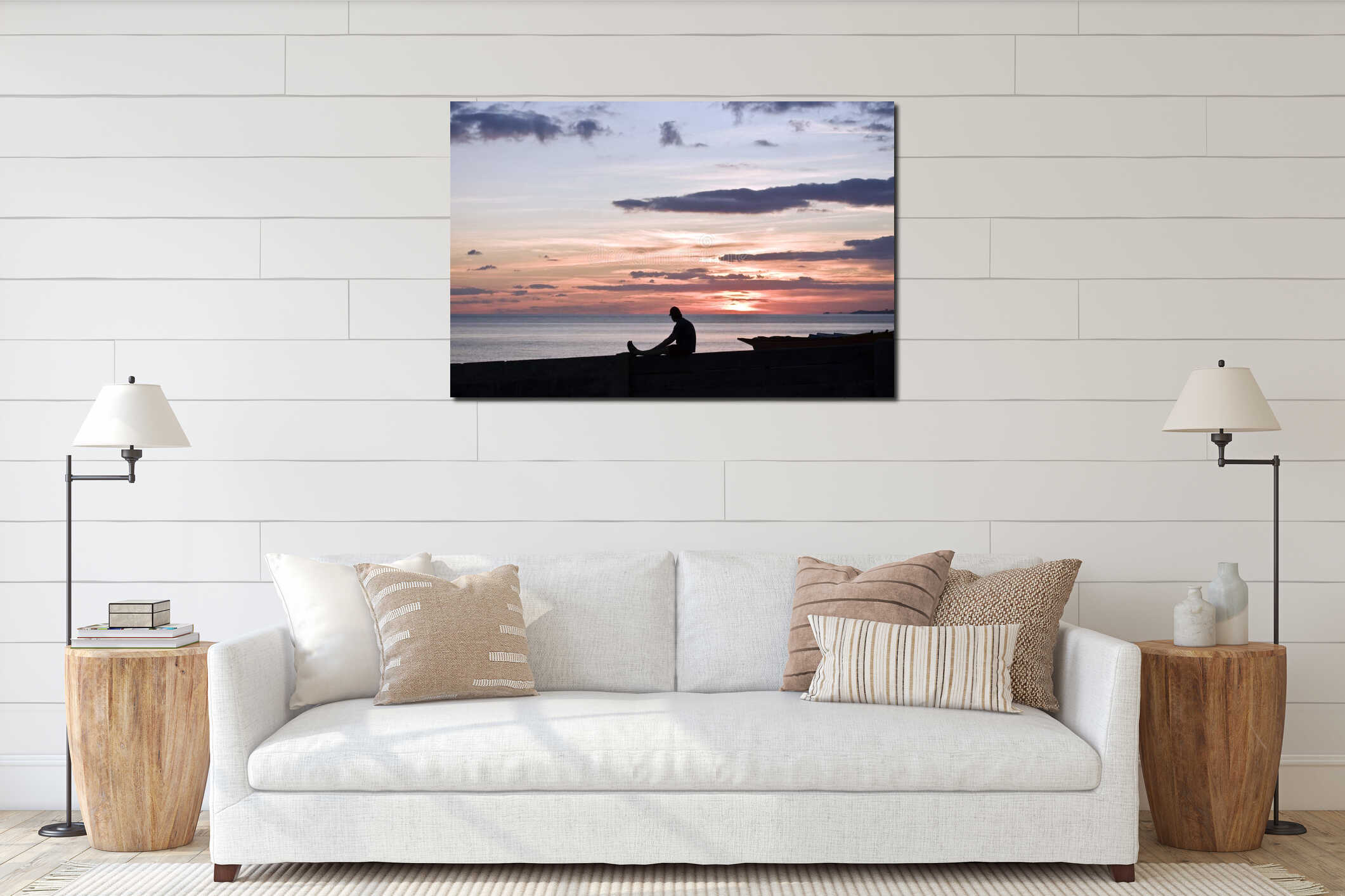 A man sitting and looking at the beach at sunset. interior mockup