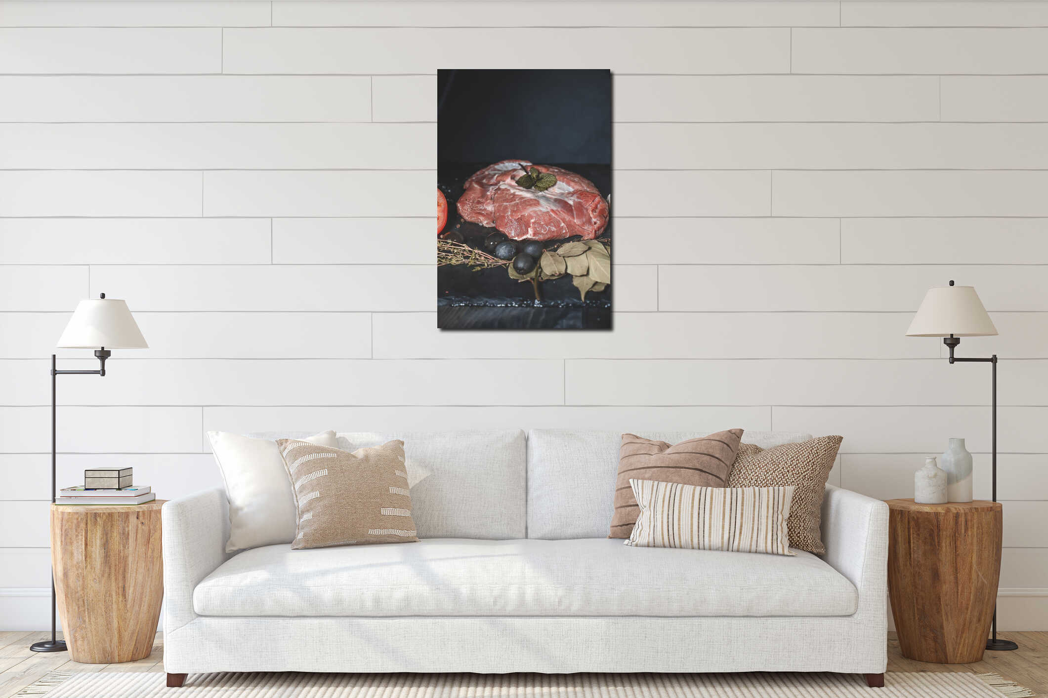 On a dark countertop, a piece of raw beef meat, decorated with thyme and chestnut leaf, black large olives and a head of garlic interior mockup