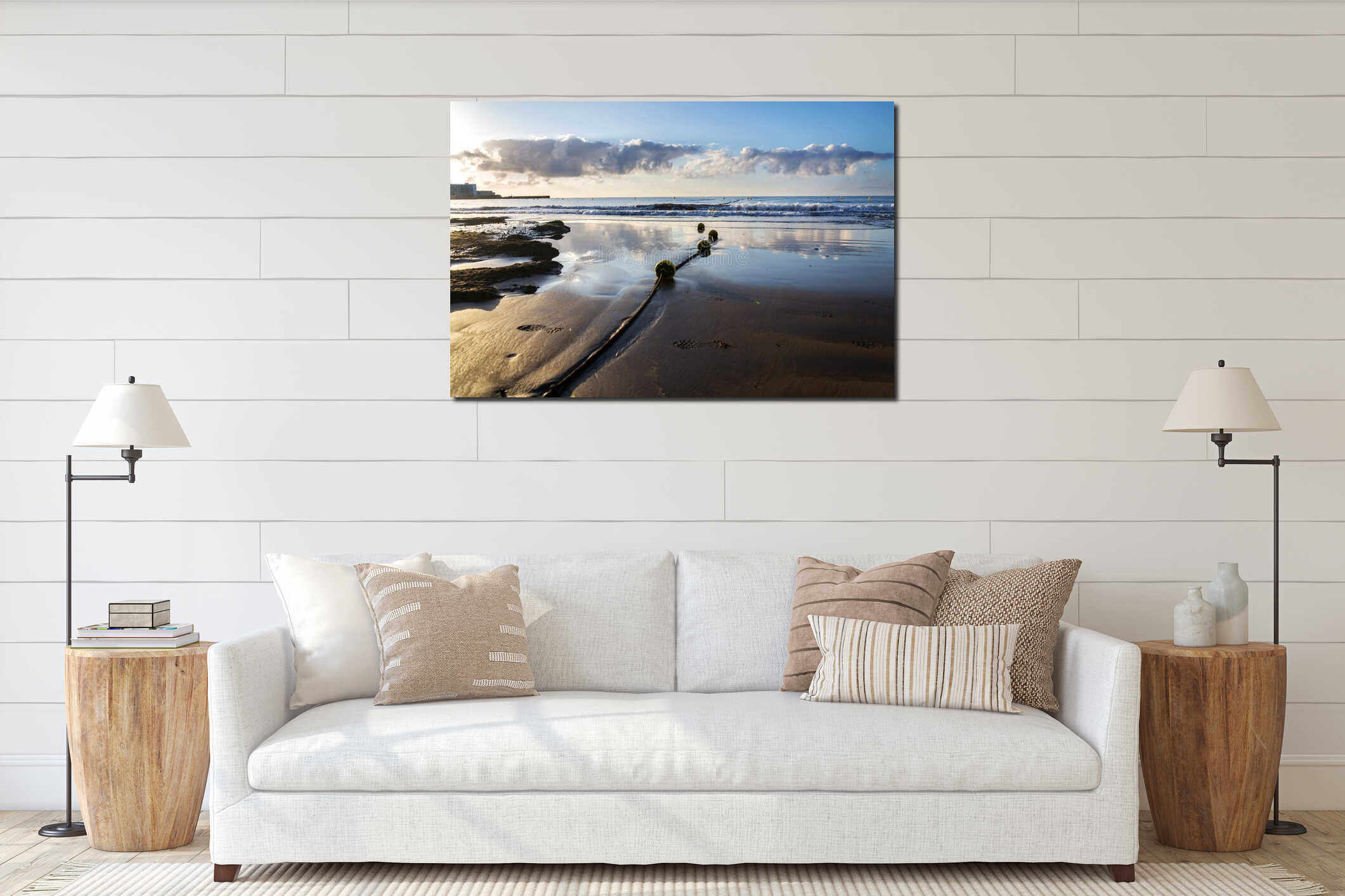 Yellow buoys on rope lying on sandy beach with small waves on sea and beautiful clouds during sunrise, sunny summer morning interior mockup