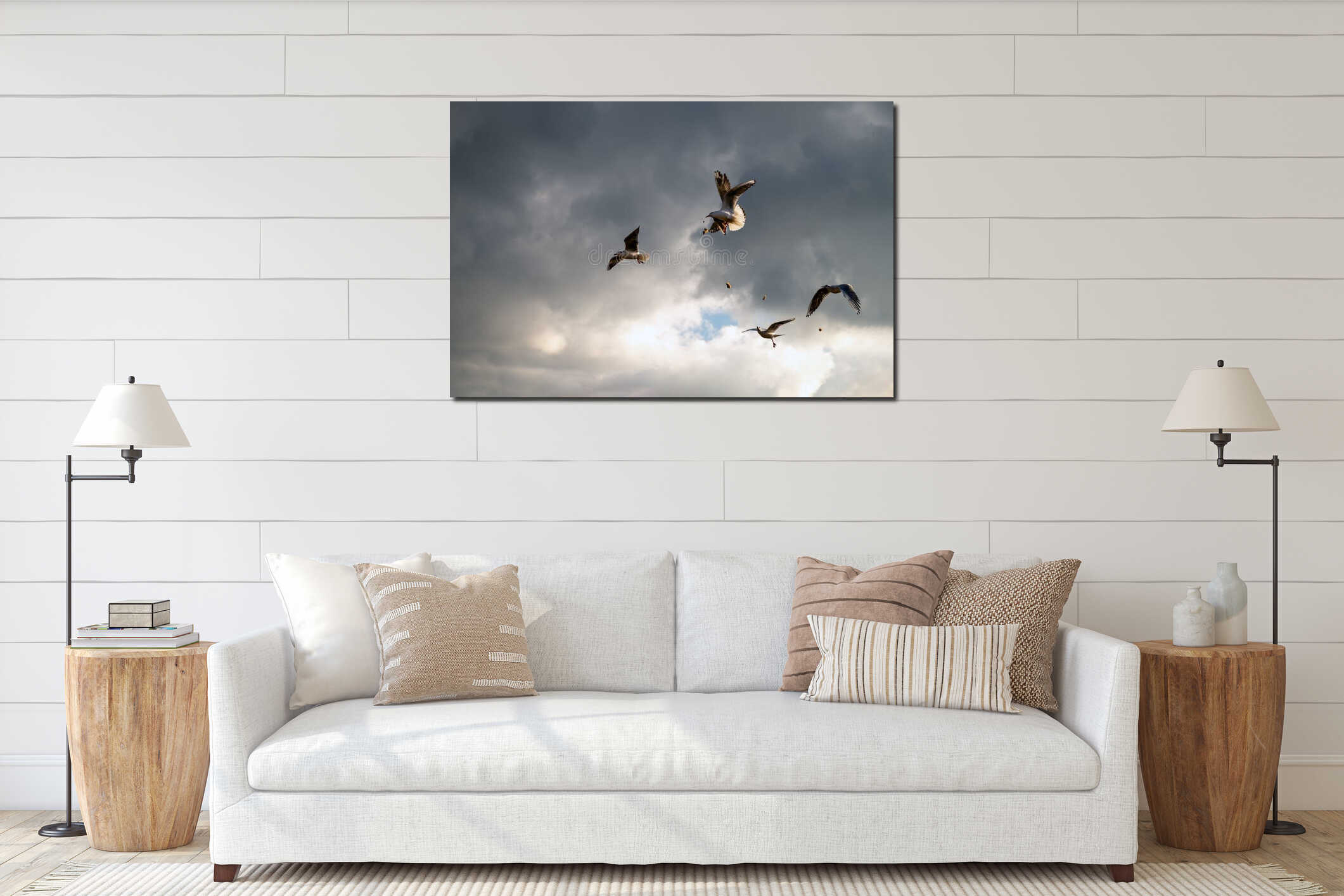 Seagulls are fighting for food. A flying seagull bird in the sky amid gloomy clouds during an impending thunderstorm. interior mockup