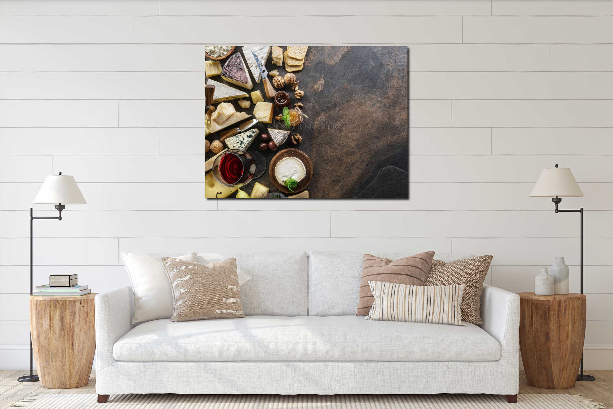 Cheese platter with organic cheeses, fruits, nuts and wine on stone background. Top view. Tasty cheese starter interior mockup
