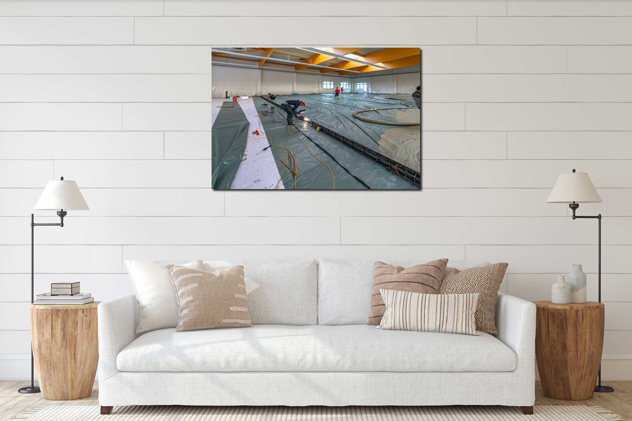 Screed is poured on a construction site inside a large factory building interior mockup