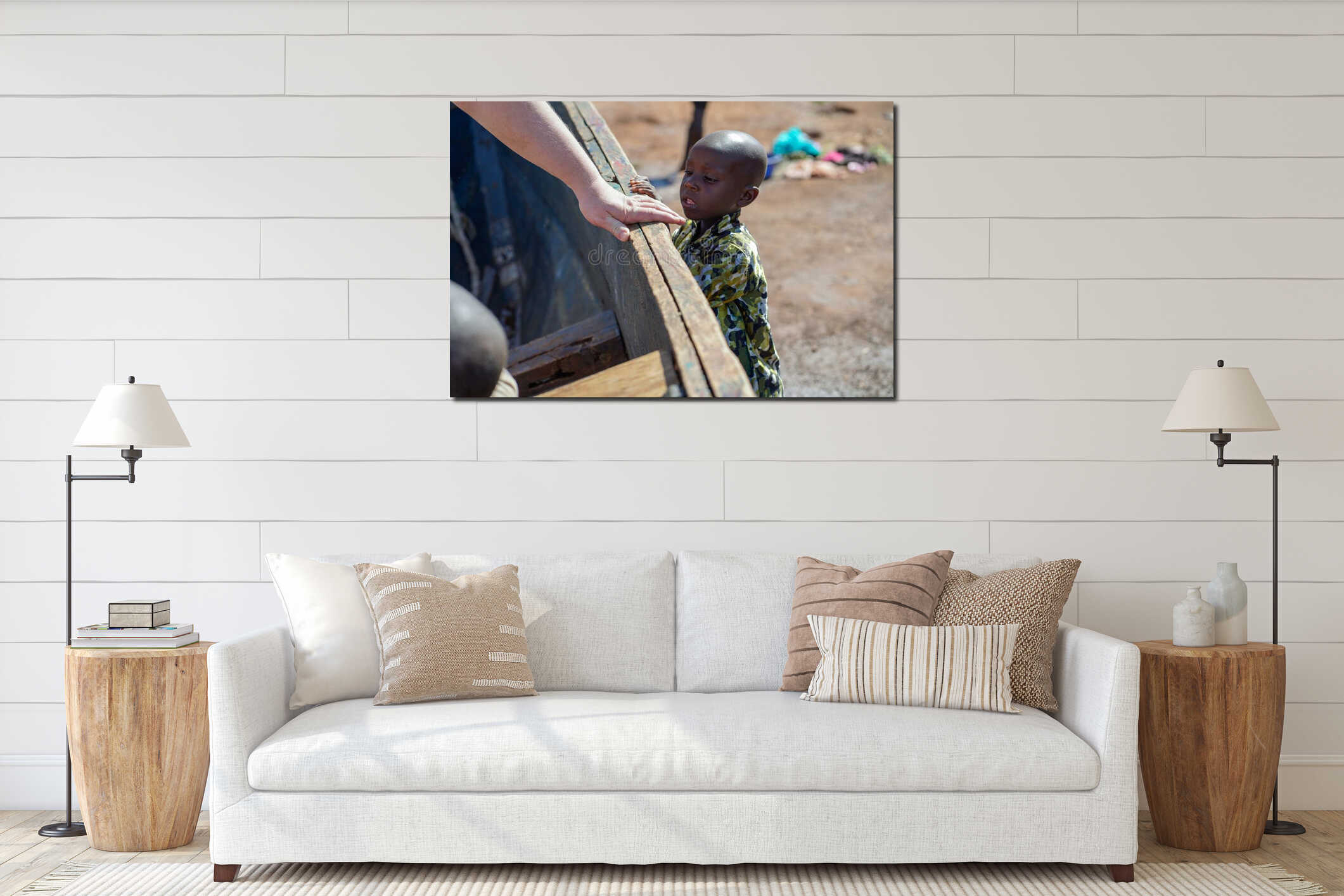 December, 2019. Africa, Uganda, Victoria lake, A small dark-skinned boy looks at the white hand of a fat tourist getting interior mockup