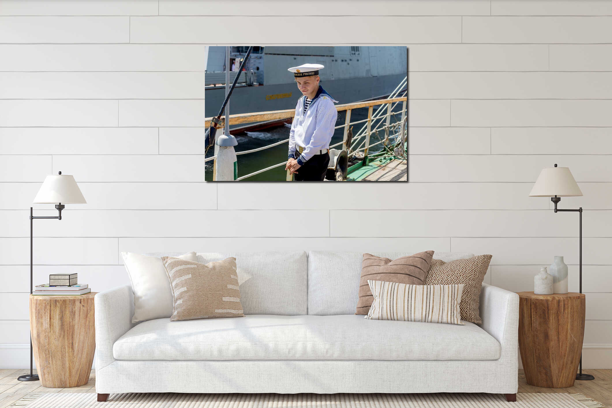 Portrait of young sailor in official marine uniform on the deck of the sailboat. interior mockup