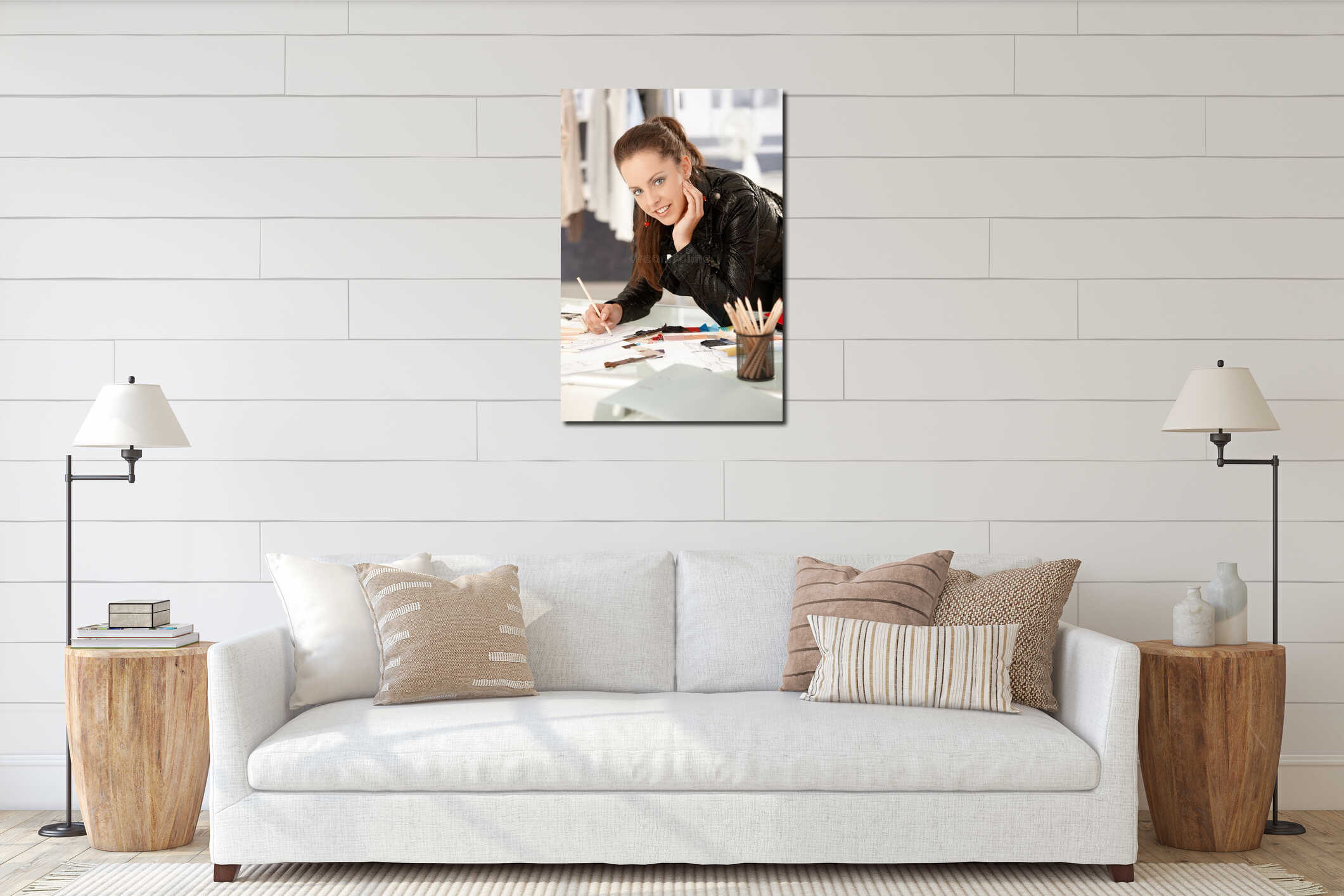 Pretty young fashion designer working in studio interior mockup