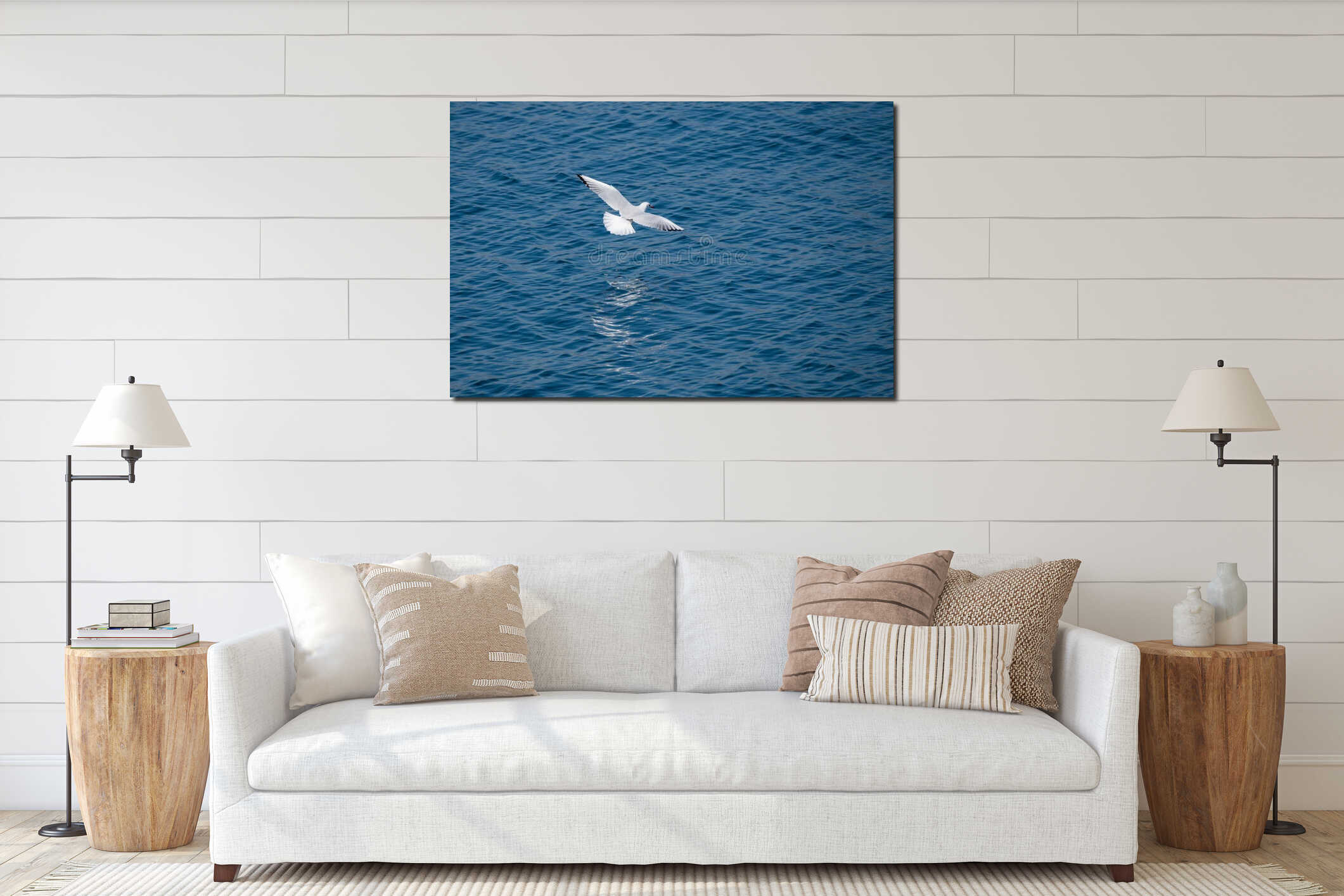 White seagull flying low above sea surface interior mockup