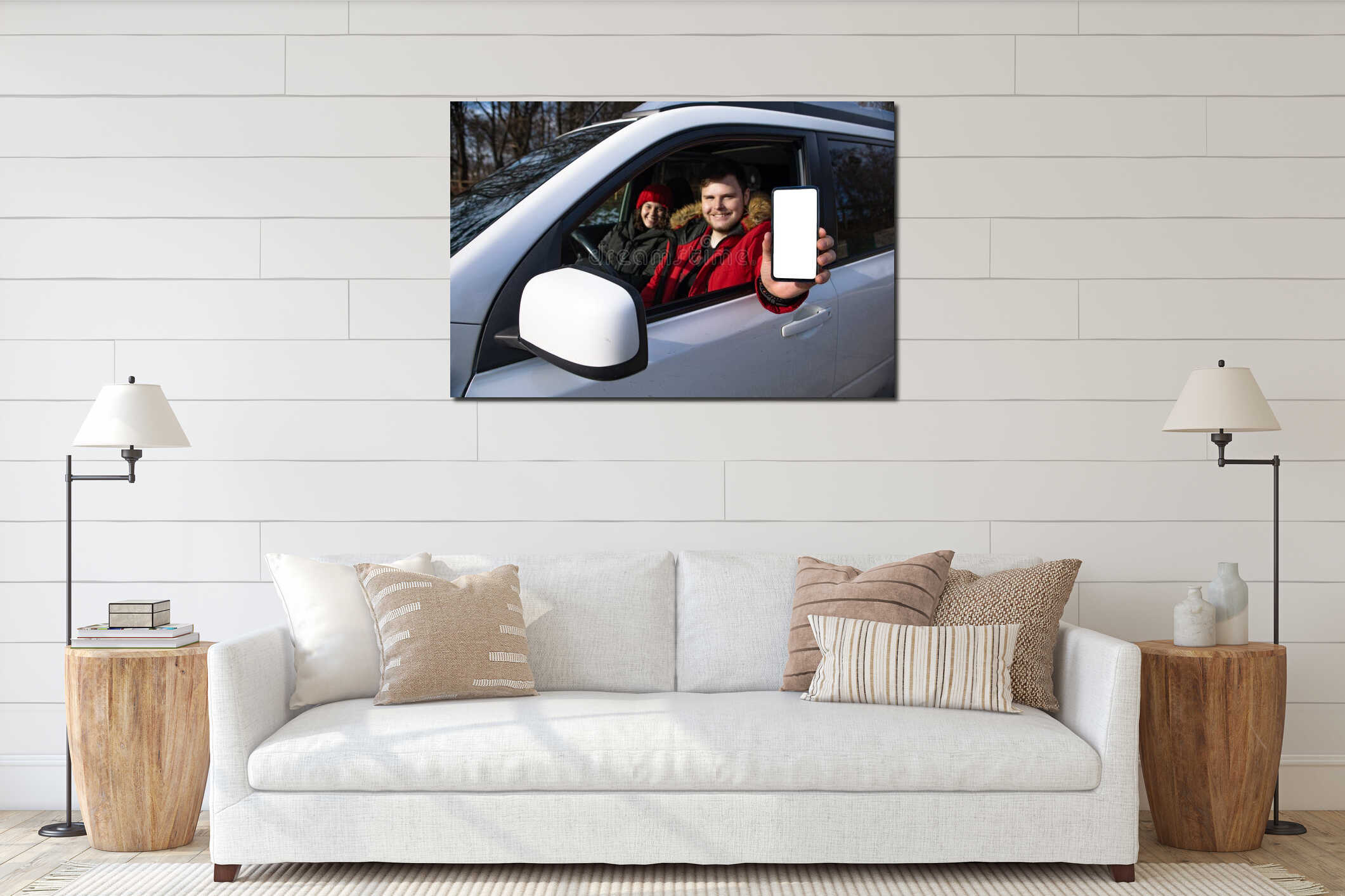 couple sitting in rent car man holding phone with white empty screen interior mockup