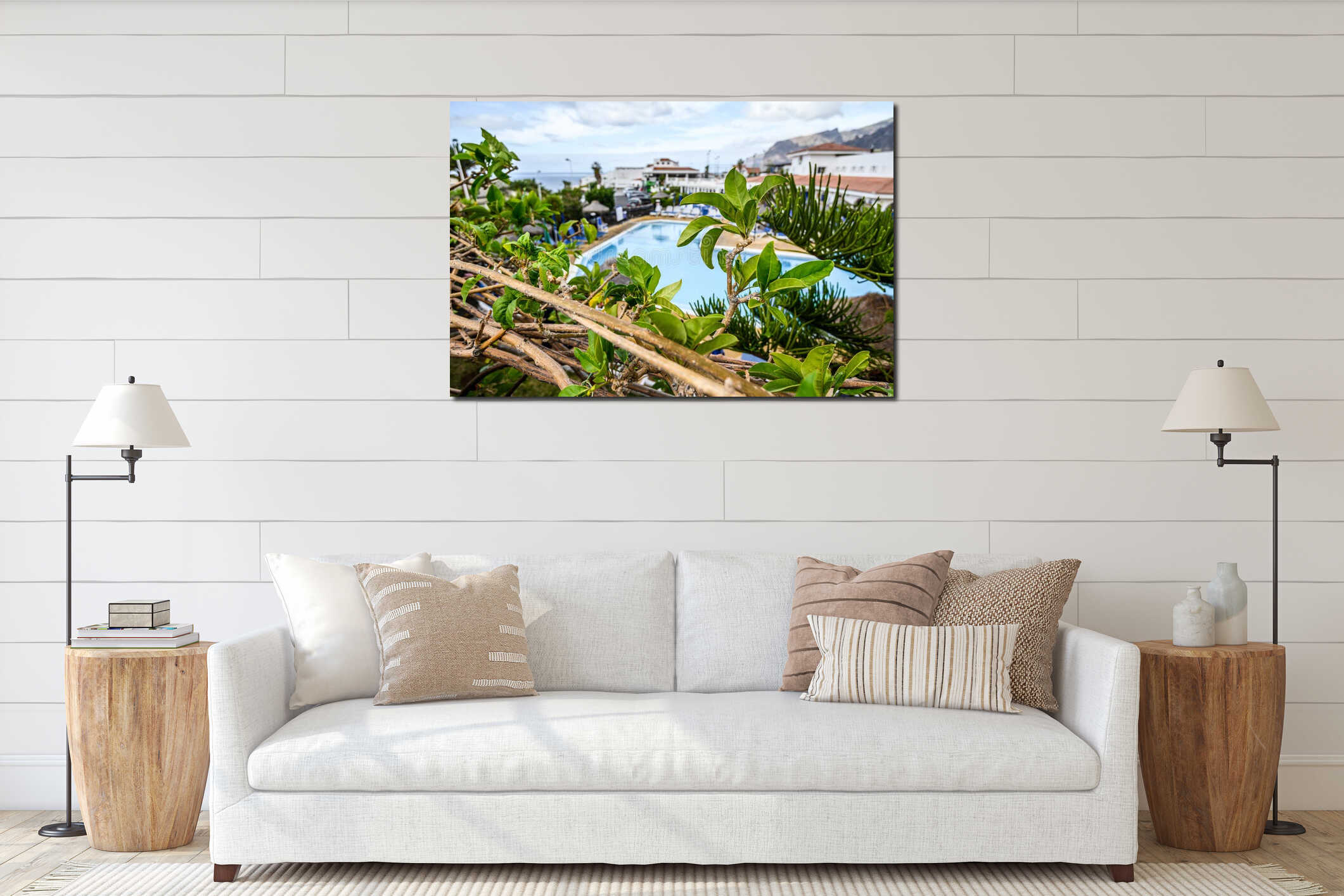 Beautiful background with green leaves and a pool in the background. Selective focus. Los Gigantes, Tenerife interior mockup
