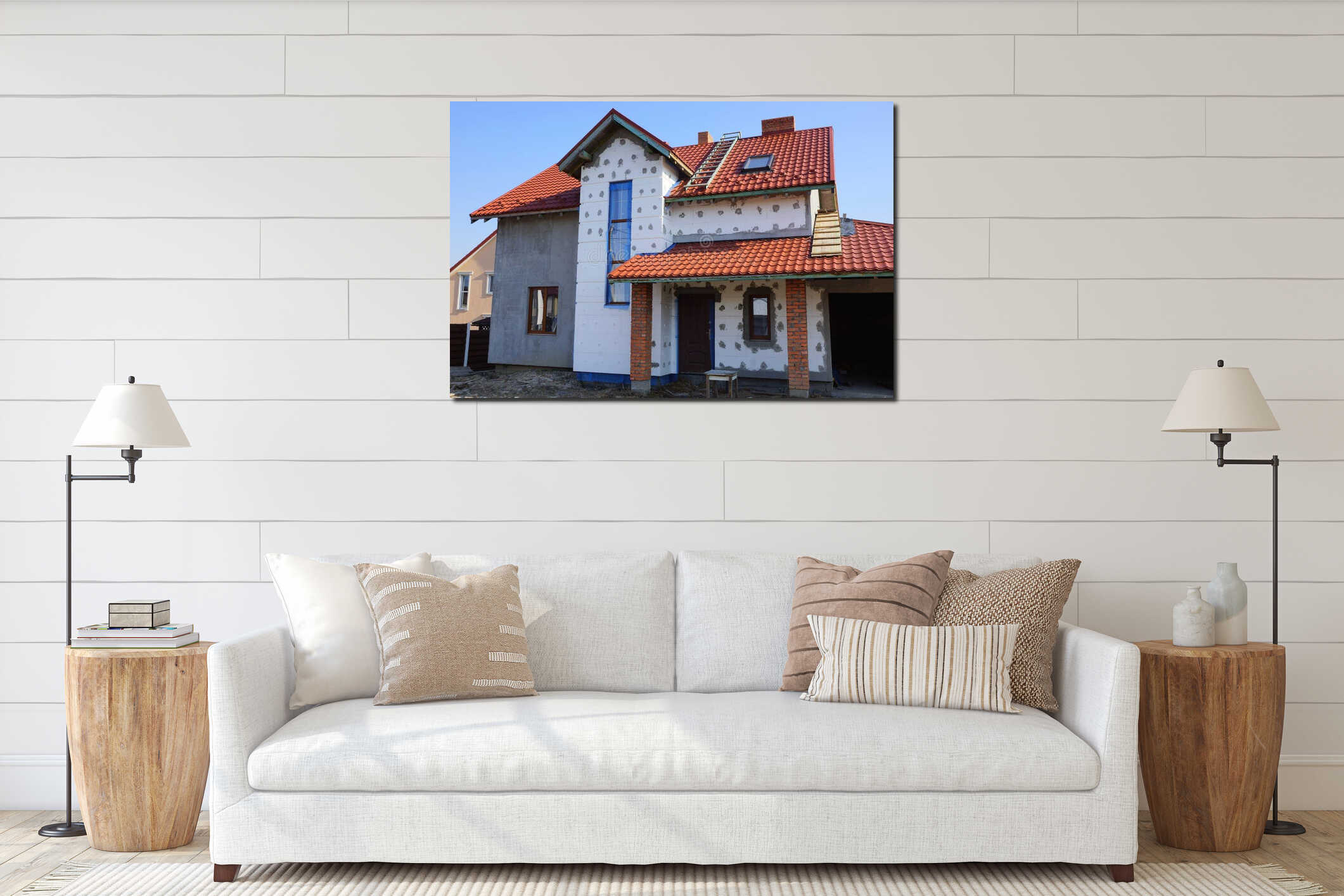Large unfinished private house with white insulation on a gray wall under a red tile roof interior mockup
