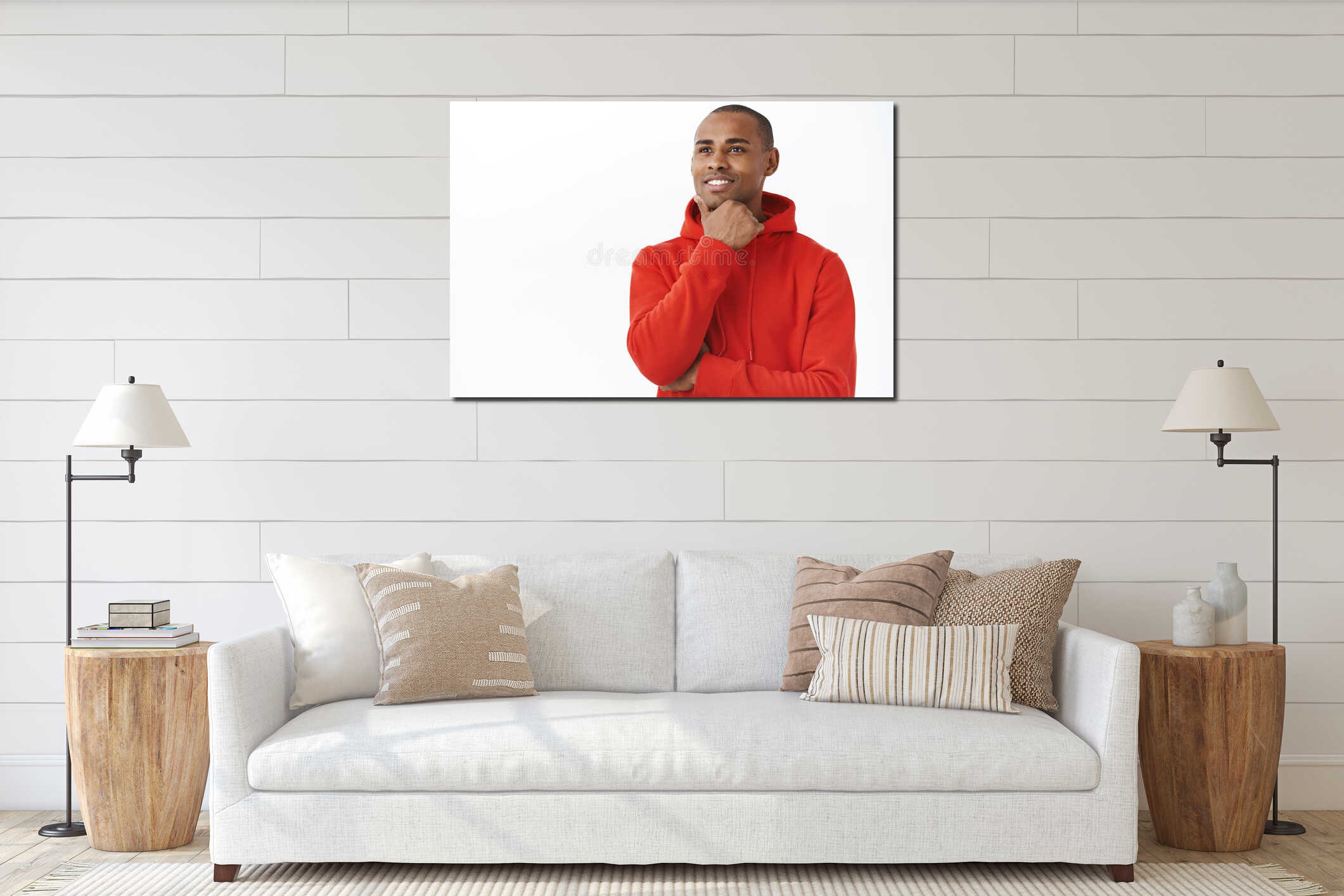 Close-up portrait of thoughtful young daydreaming african-american man, touching chin and looking away with pleased interior mockup
