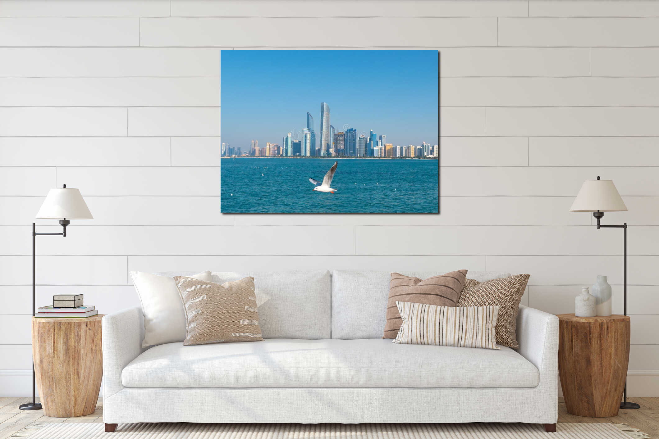 Seagull flying in front of luxury panorama of skyscrapers. Amazing daytime view of Abu Dhabi financial district skyline.  interior mockup