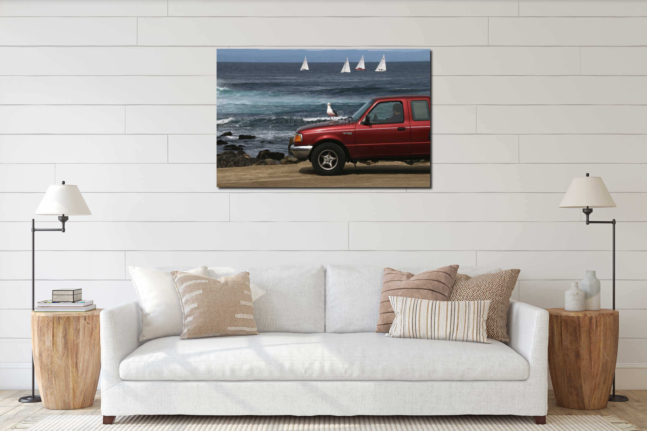 3/29/2020: A man sits in his red truck by the ocean during shelter in place, Pacific Grove, CA. interior mockup