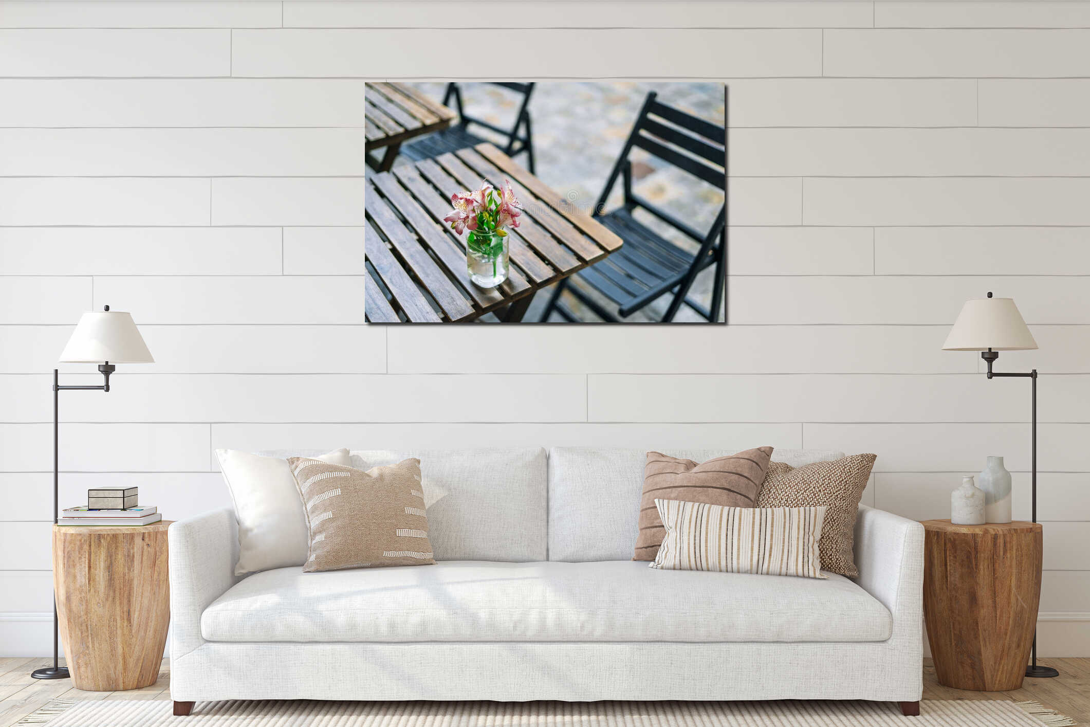 Beautiful alstroemeria in vase on wooden table in summer cafe. Gentle summer bouquet in a glass vase. Pink flowers on a sunny day. interior mockup