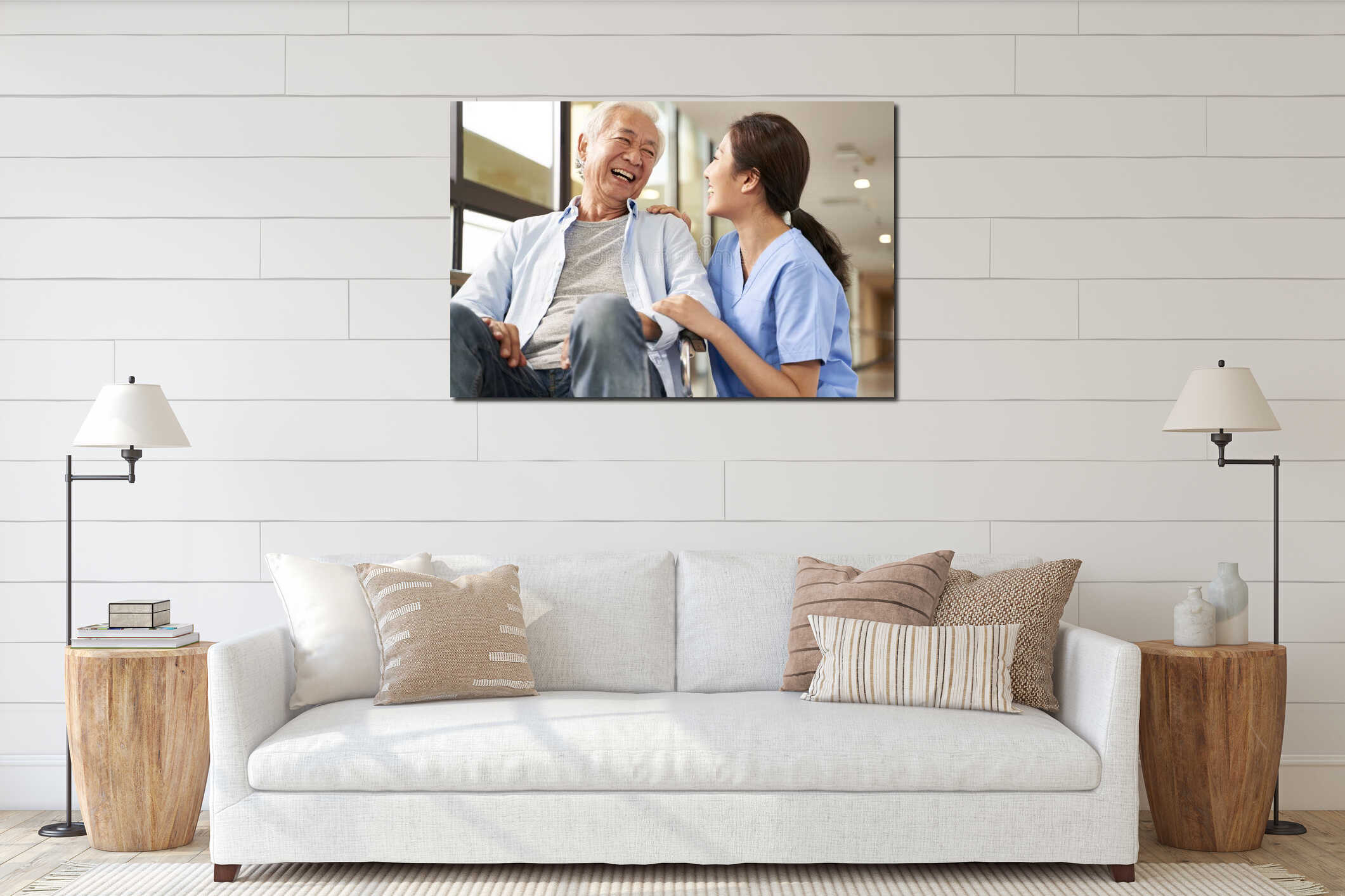 Young friendly asian female caregiver talking to elderly man in nursing home interior mockup