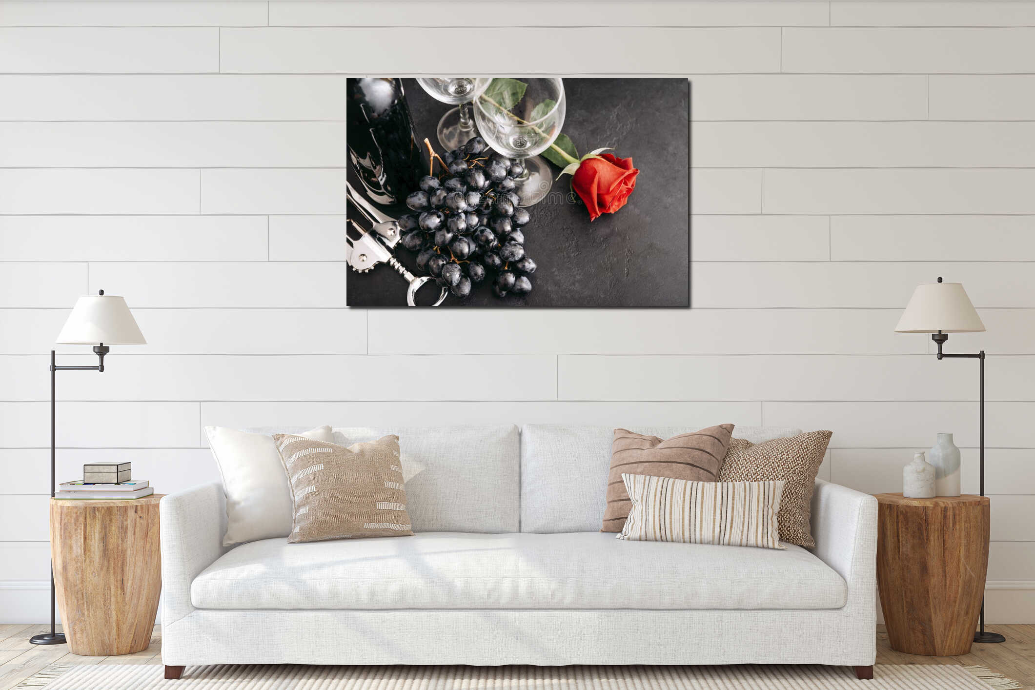 Bottle of wine, 2 empty glasses, bunch of dark grapes, red rose flower, corkscrew on a black background, top view interior mockup