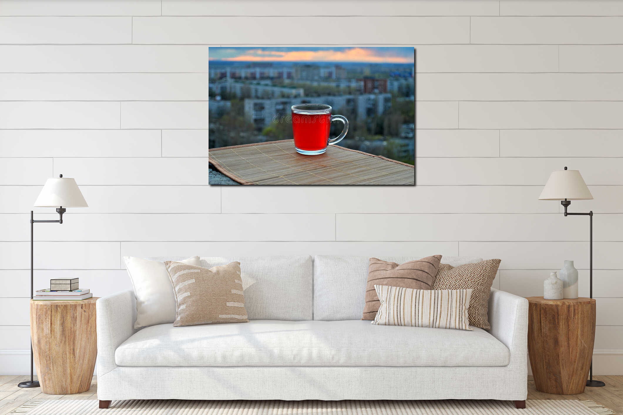 A mug of hot fruit drink stands on a bamboo napkin against a blurred background of the morning panorama of the city of Tolyatti interior mockup