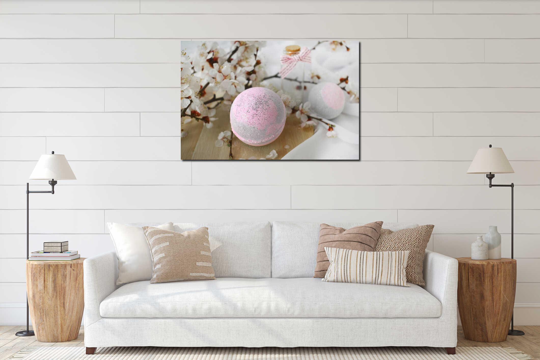 Romantic spa cosmetic composition. Close up bath bombs, blossom branch on light background. interior mockup