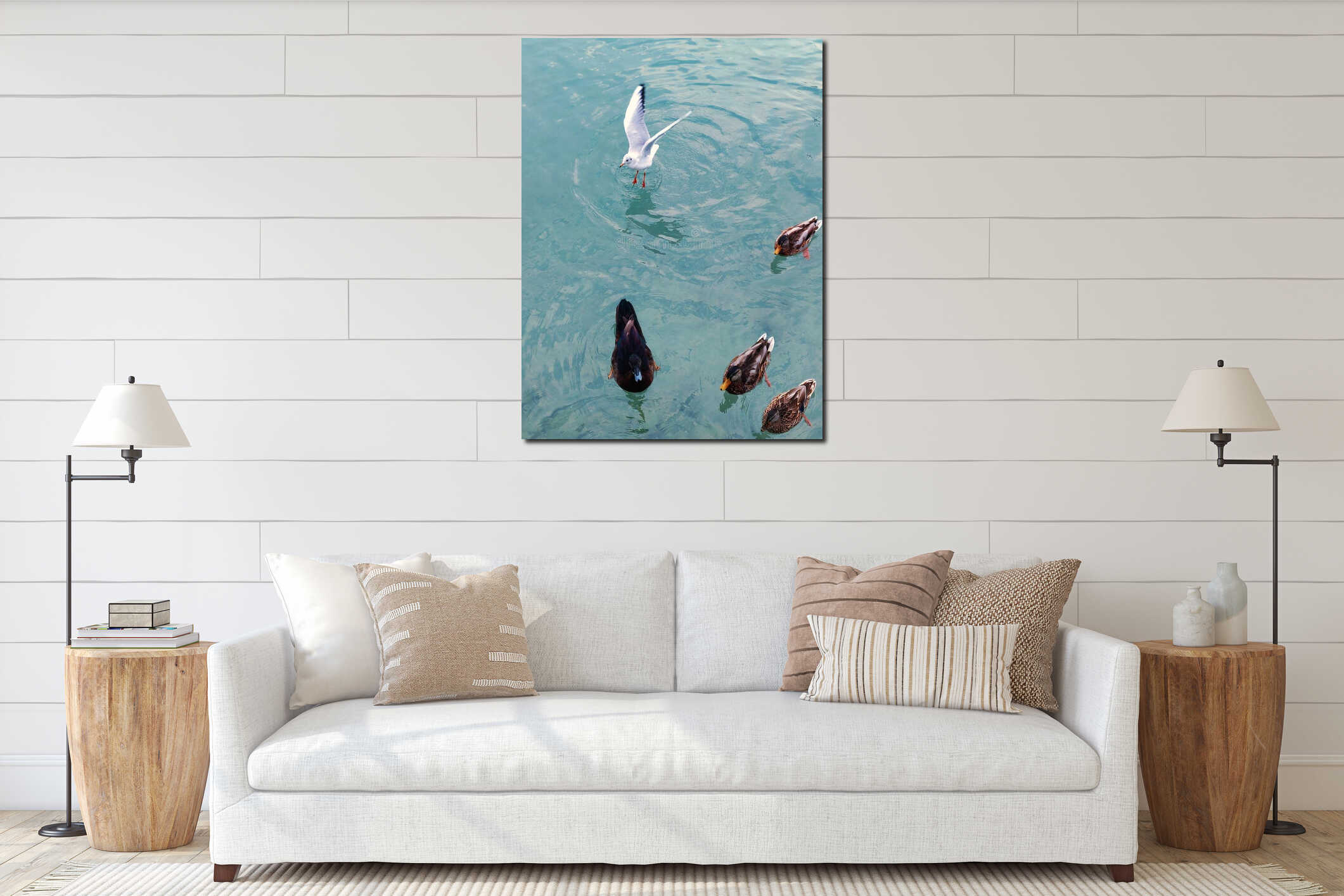 Vertical high angle shot of ducks and a seagull in a clear blue water interior mockup
