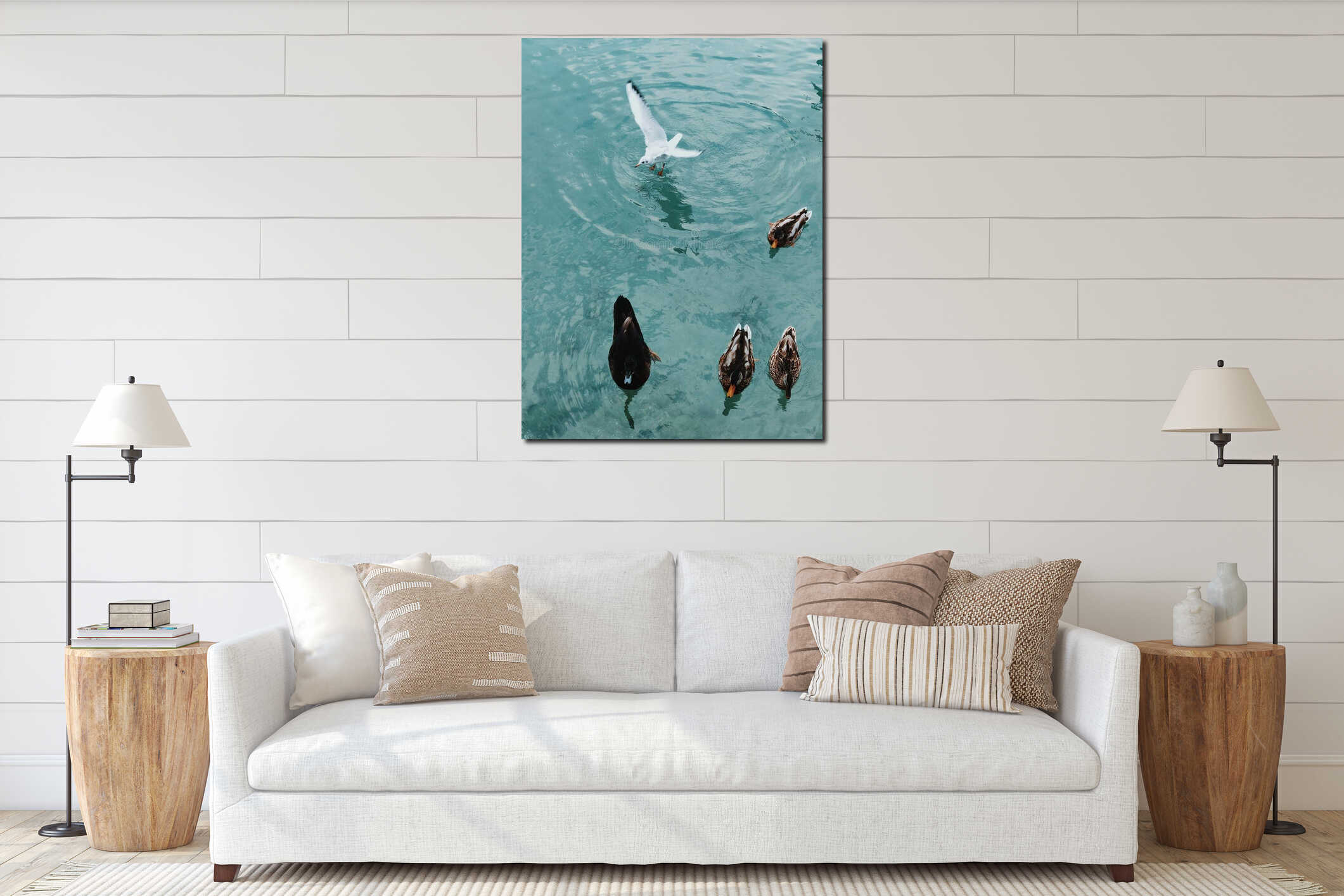 Vertical high angle shot of ducks and a seagull in a clear blue water interior mockup