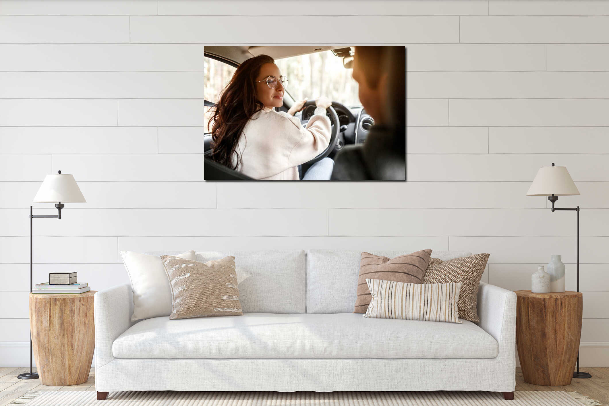 Happy young family rides in a car in the forest. A woman is driving a car, and man is sitting nearby. Traveling by car interior mockup