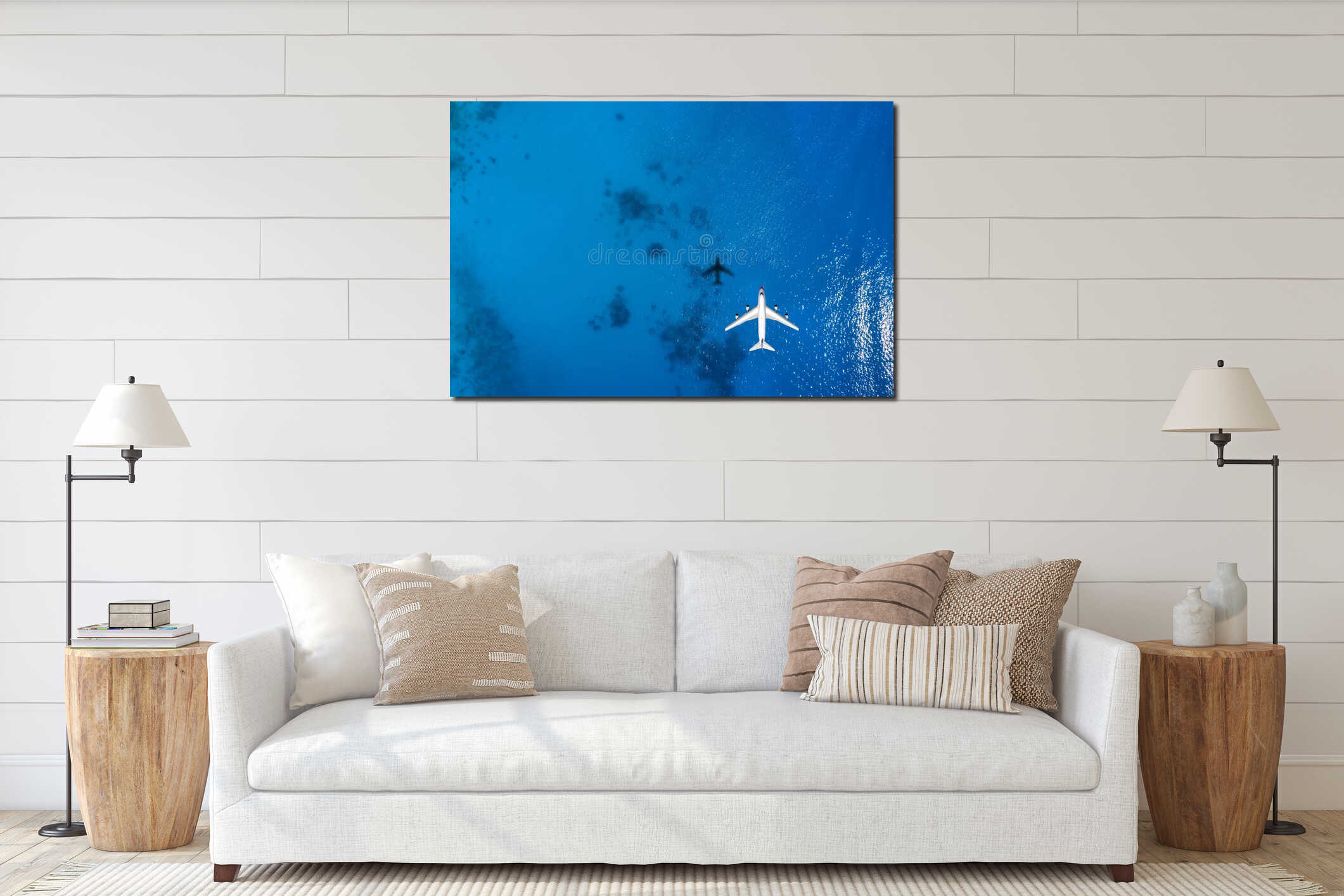 Aerial top down view of an airplane flying over blue sea interior mockup