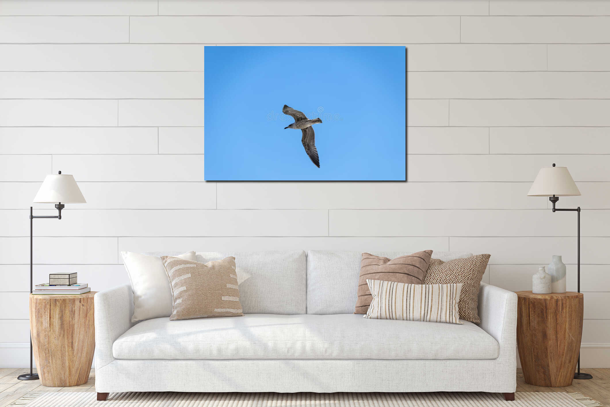 Flying seagull in front of a blue sky interior mockup
