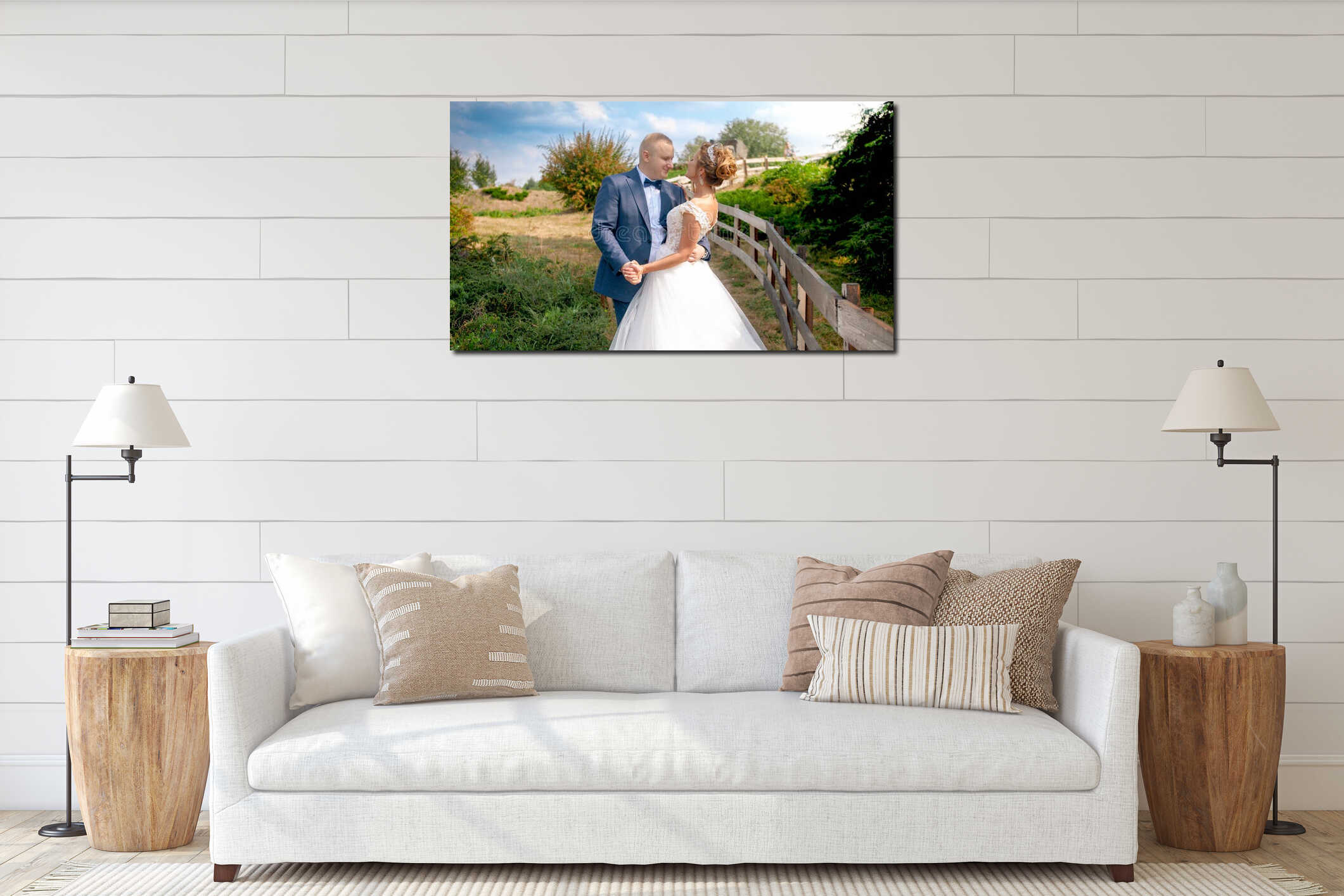 Portrait of elegant handsome groom embracing and looking at his young bride in countryside interior mockup