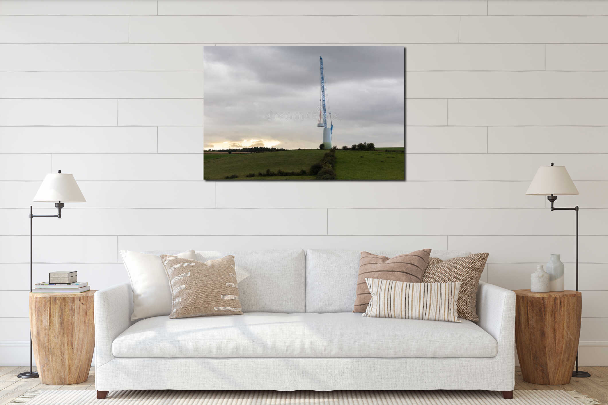 A wind turbine is being built on the field. A large crane is in use. interior mockup