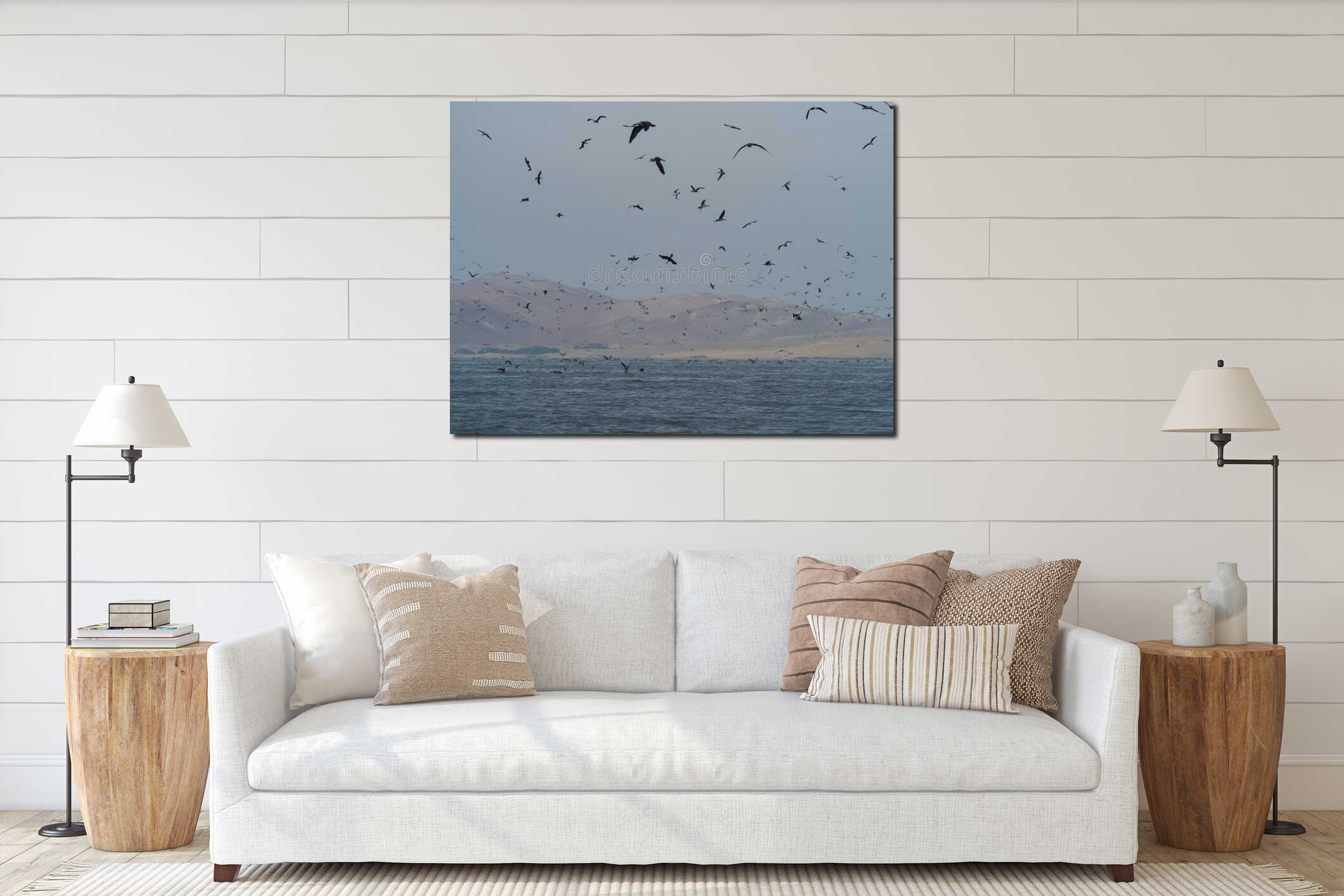 Many seabirds flying at sea in front of desert dunes at Ballestas islands interior mockup