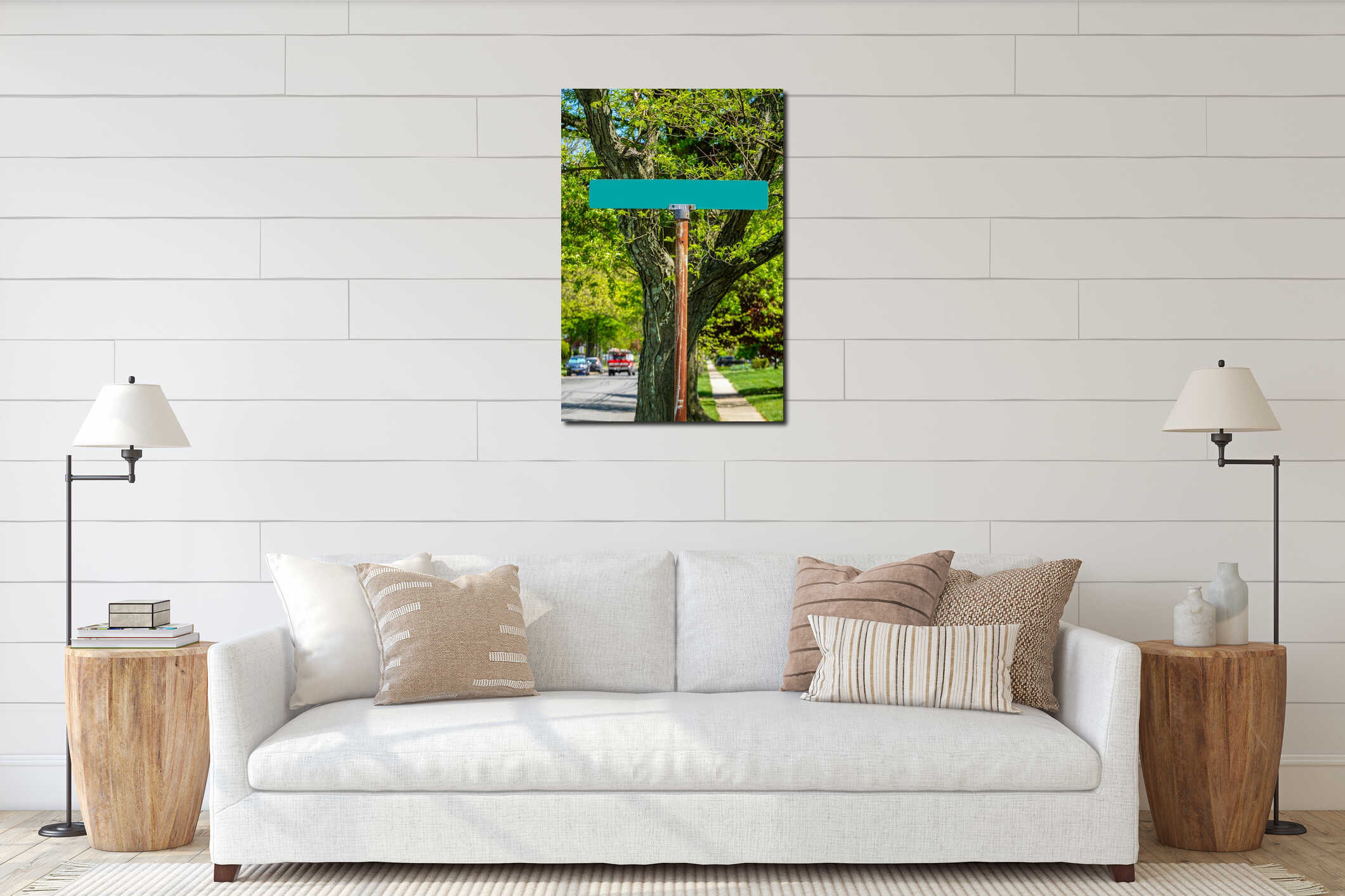 Blank green street sign on a rusty metal pole with green leaves and a tree in the background interior mockup