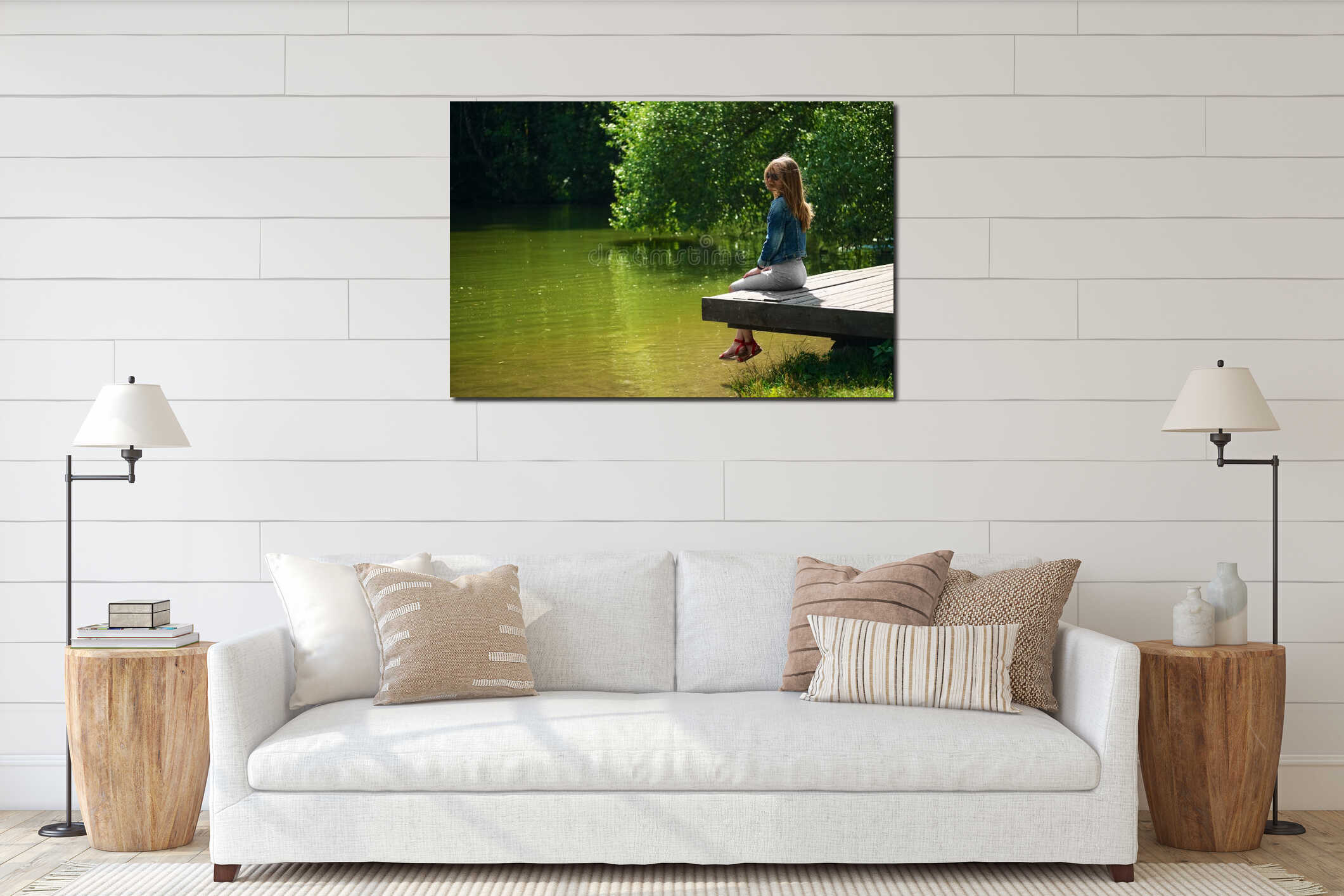 Side view of dreaming girl sitting on wooden pier on river bank interior mockup