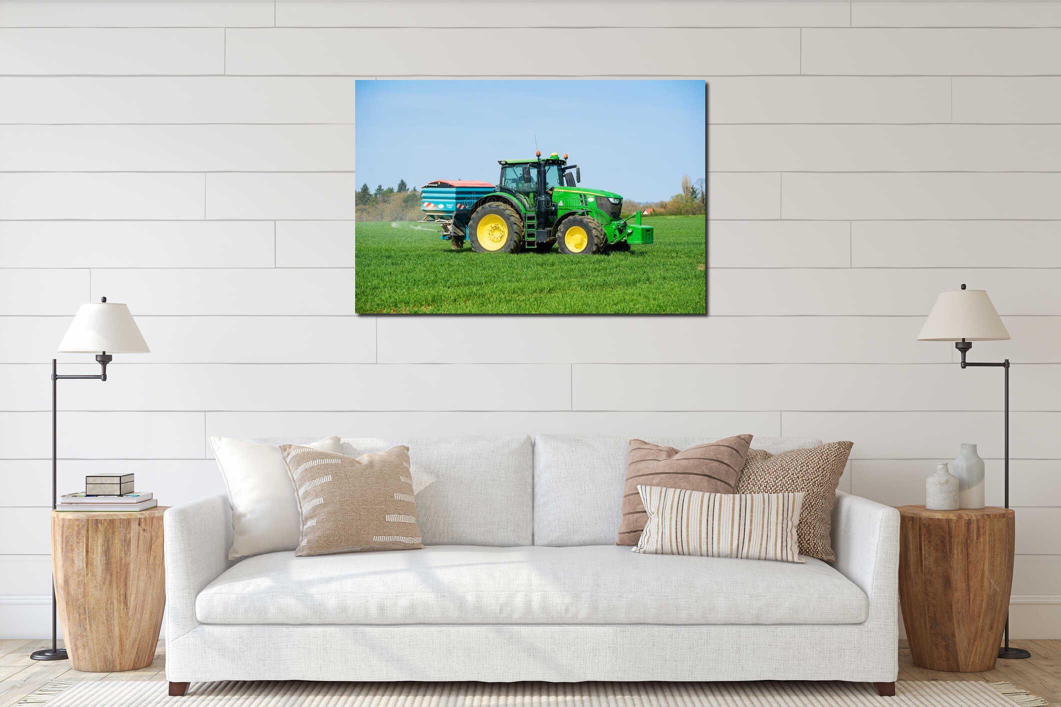 Tractor sprinkling fertiliser on wheat crop field. Hertfordshire. UK interior mockup