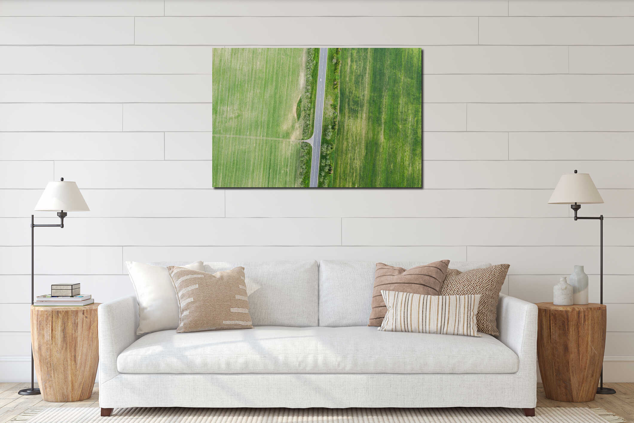 Aerial view from above of country road through the green agricultural fields interior mockup