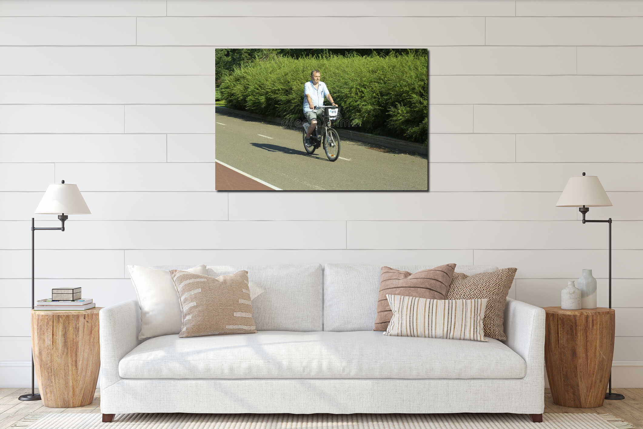 City bike rental in Moscow. A man rides a city bike in Moscow on a bicycle path in the summer on a clear day. Active leisure and interior mockup