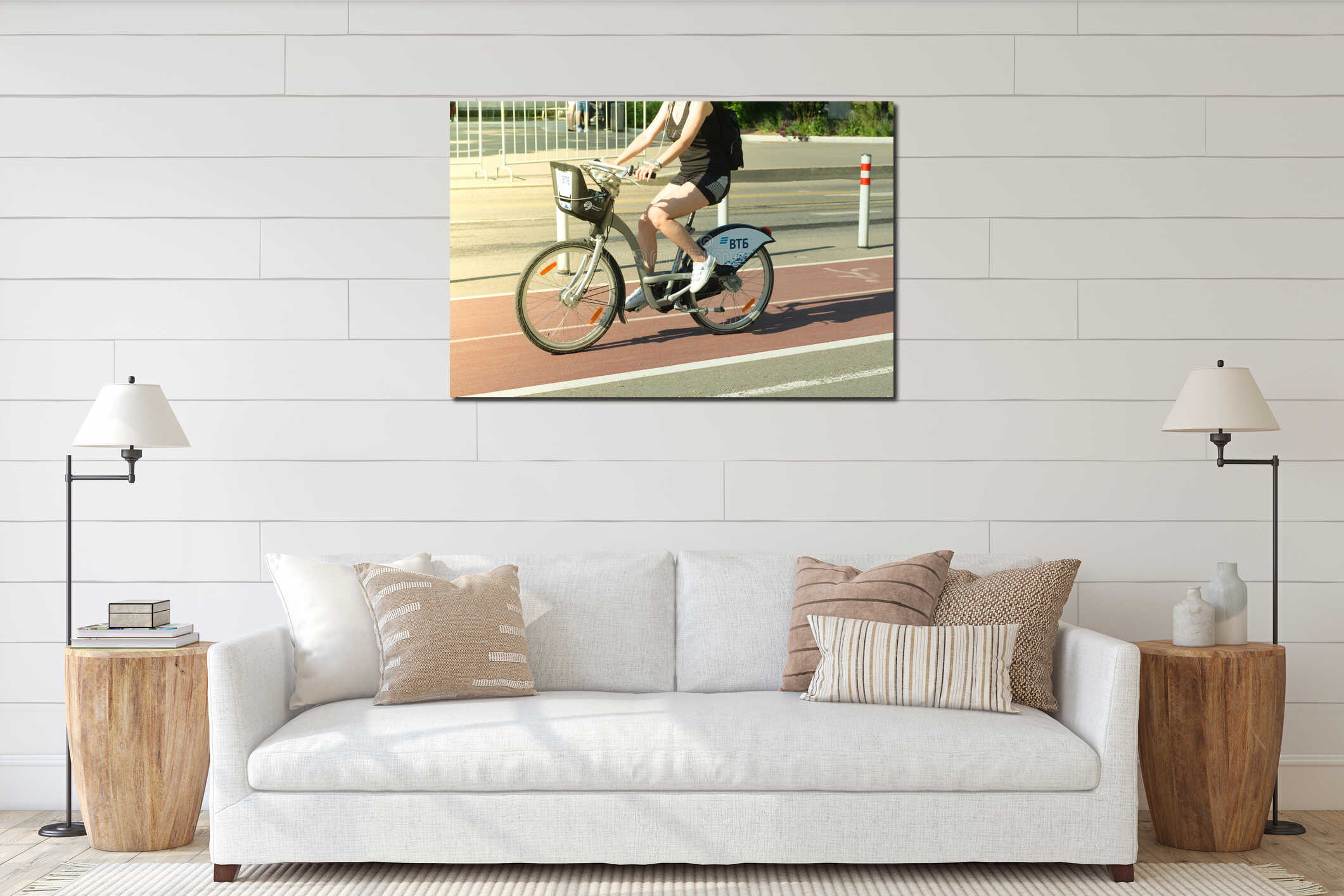 City bike rental in Moscow. A man rides a city bike in Moscow on a bicycle path in the summer on a clear day. Active leisure and interior mockup