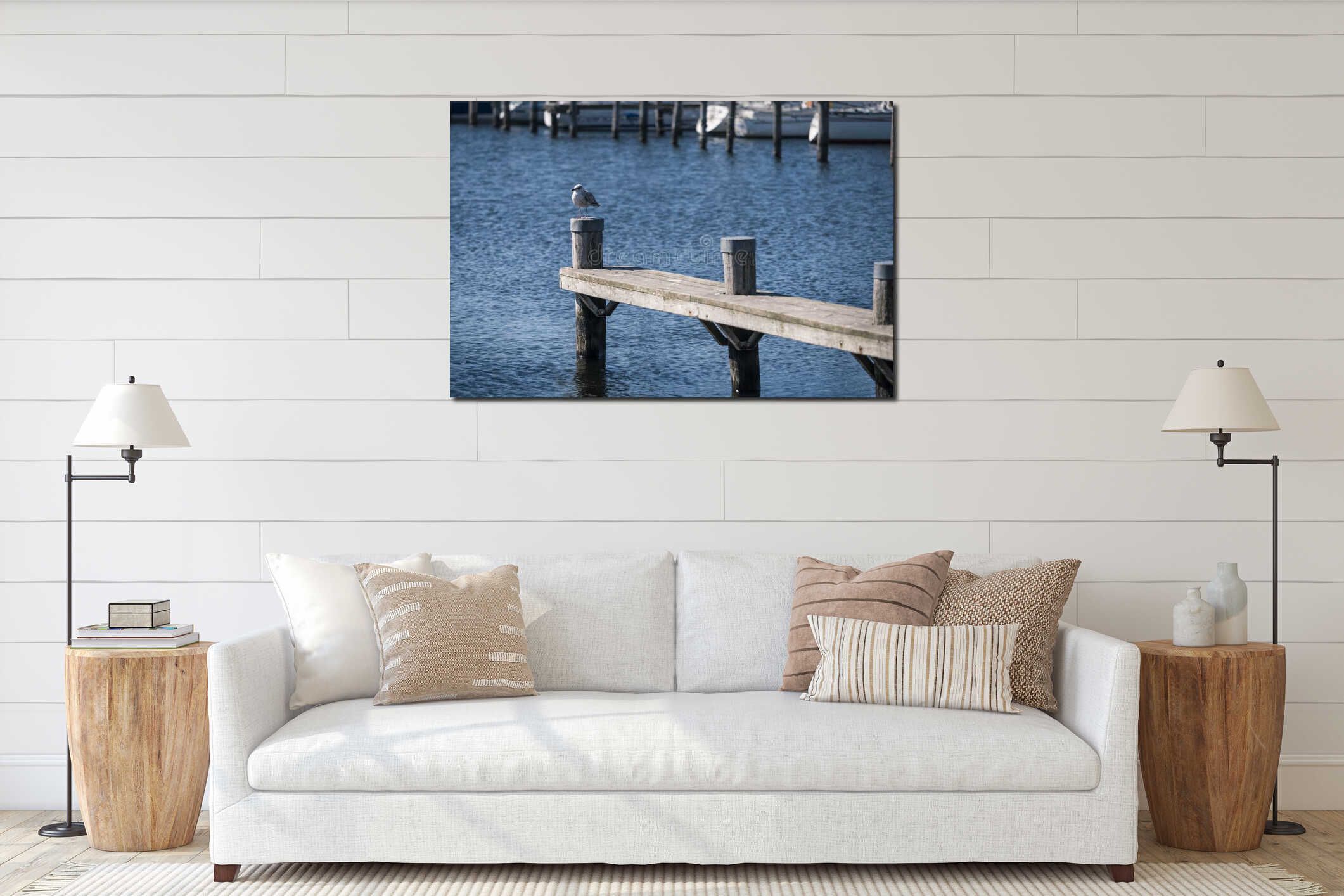 A seagull sits on a pillar in the harbor interior mockup